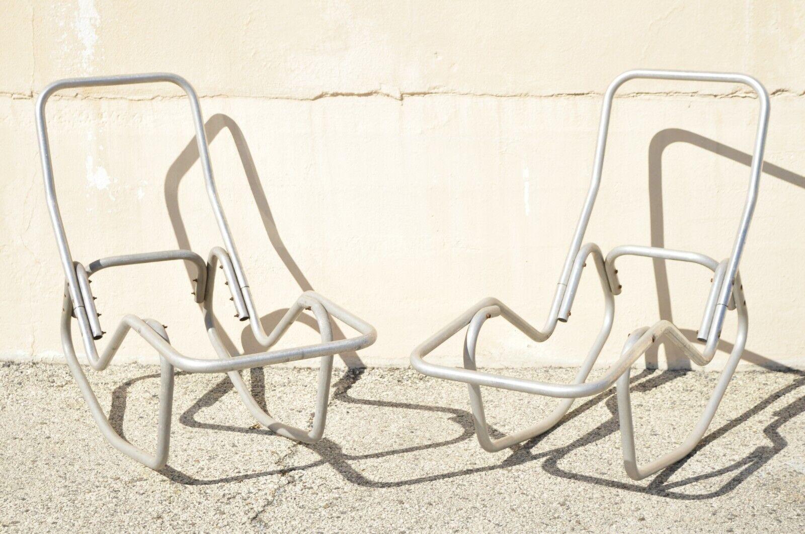 Vintage English Bartolucci for Barwa Aluminum Frame Rocking Pool Chaise Lounge Chair - a Pair. Item featured is designed by Edgar Bartolucci for Barwa, aluminum metal rocking frames, clean modernist lines, sleek sculptural form. Circa 1950.