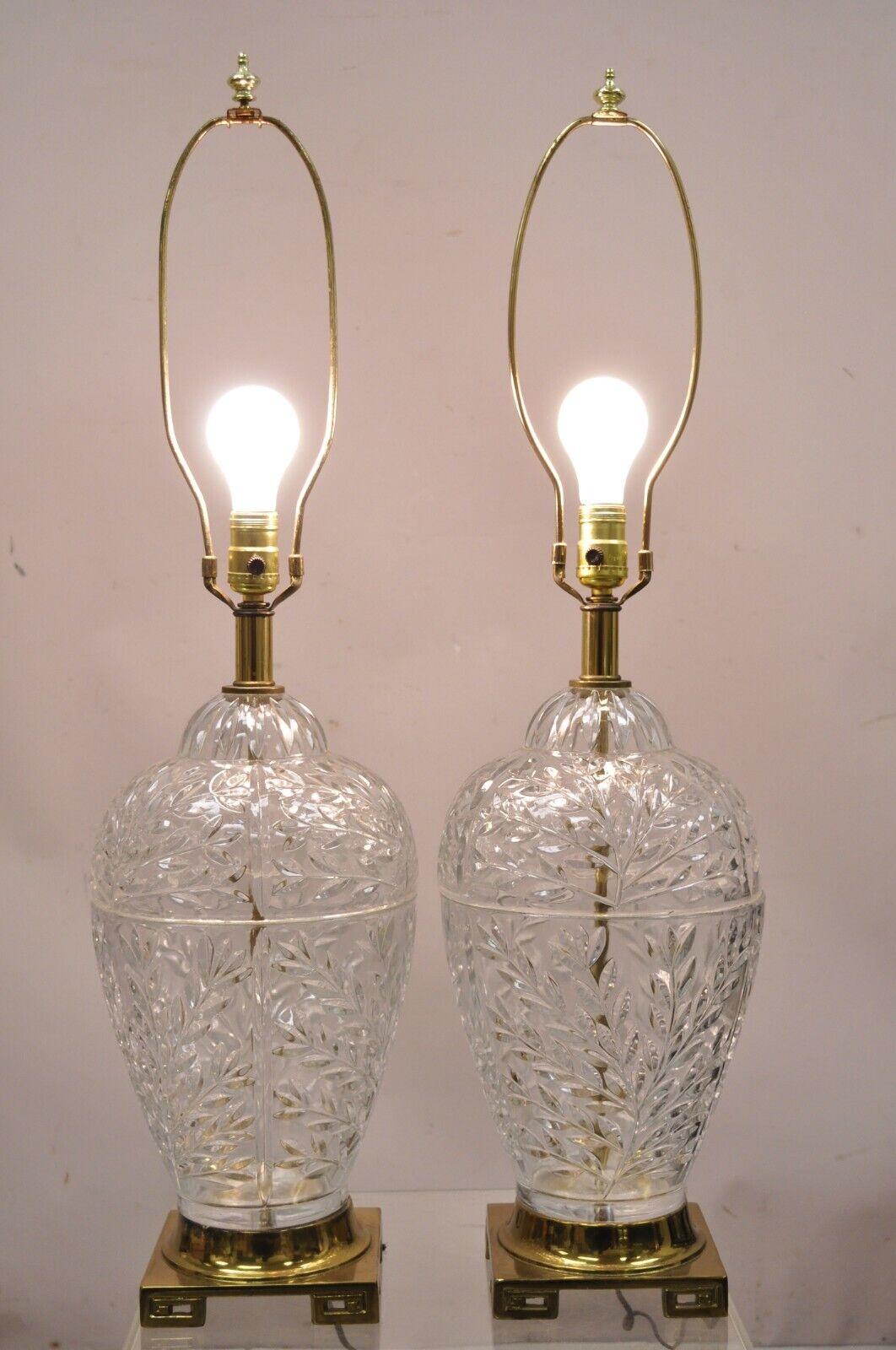 Pair Vintage French style cut crystal glass bulbous table lamps brass Greek key base. Item features a leafy design bulbous crystal body, brass finish greek key base, very nice vintage pair, quality craftsmanship, great style form. Circa Mid to Late
