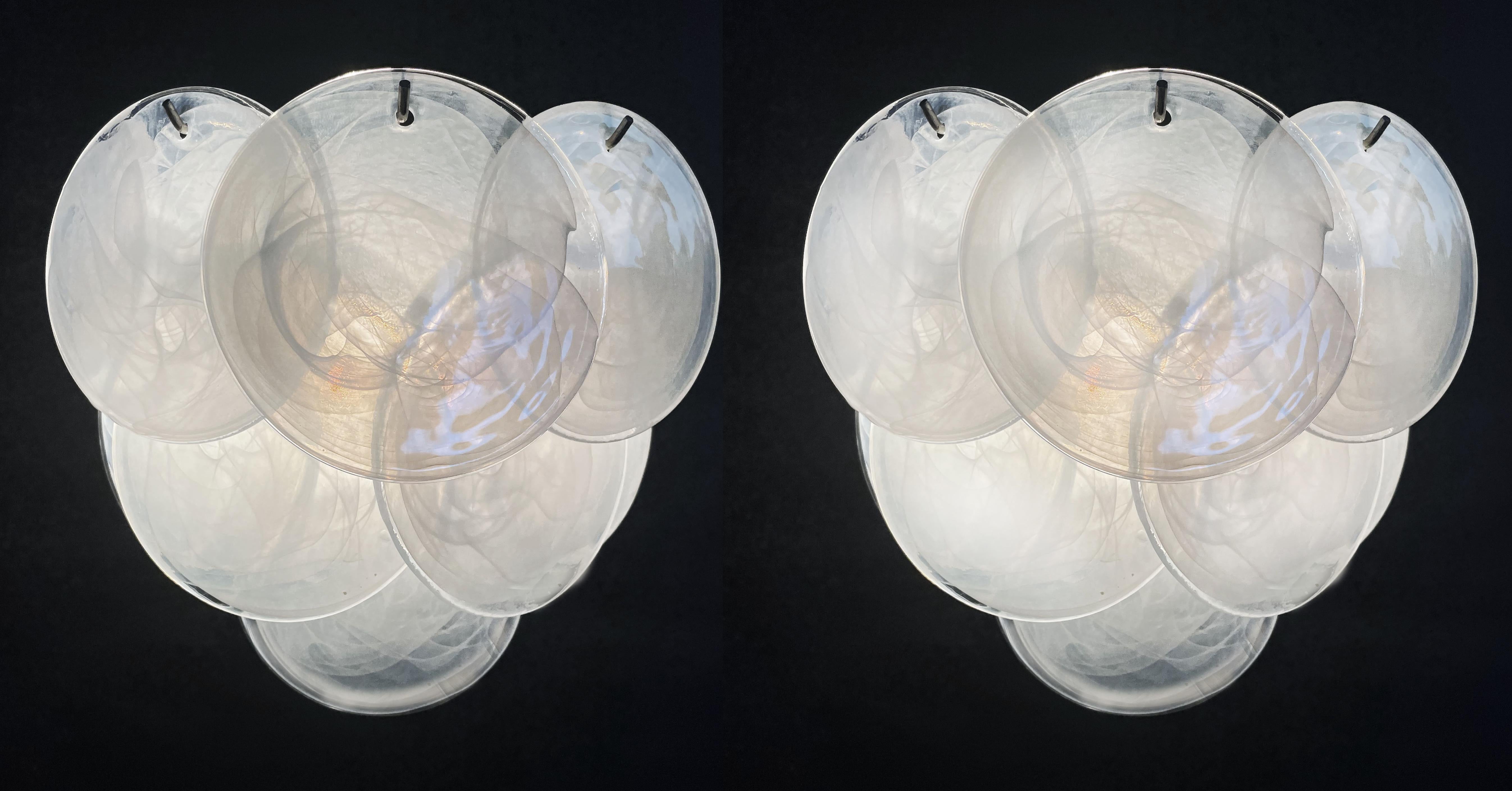 Pair  Italian Murano sconces in Vistosi style. Wall lights have 10 alabaster iridescent glasses for each. Nickel metal frame.
Period: late XX century
Dimensions:11 inches (28 cm) height; 13,40 inches (34 cm) width; 7,10 inches (18 cm) depth from the
