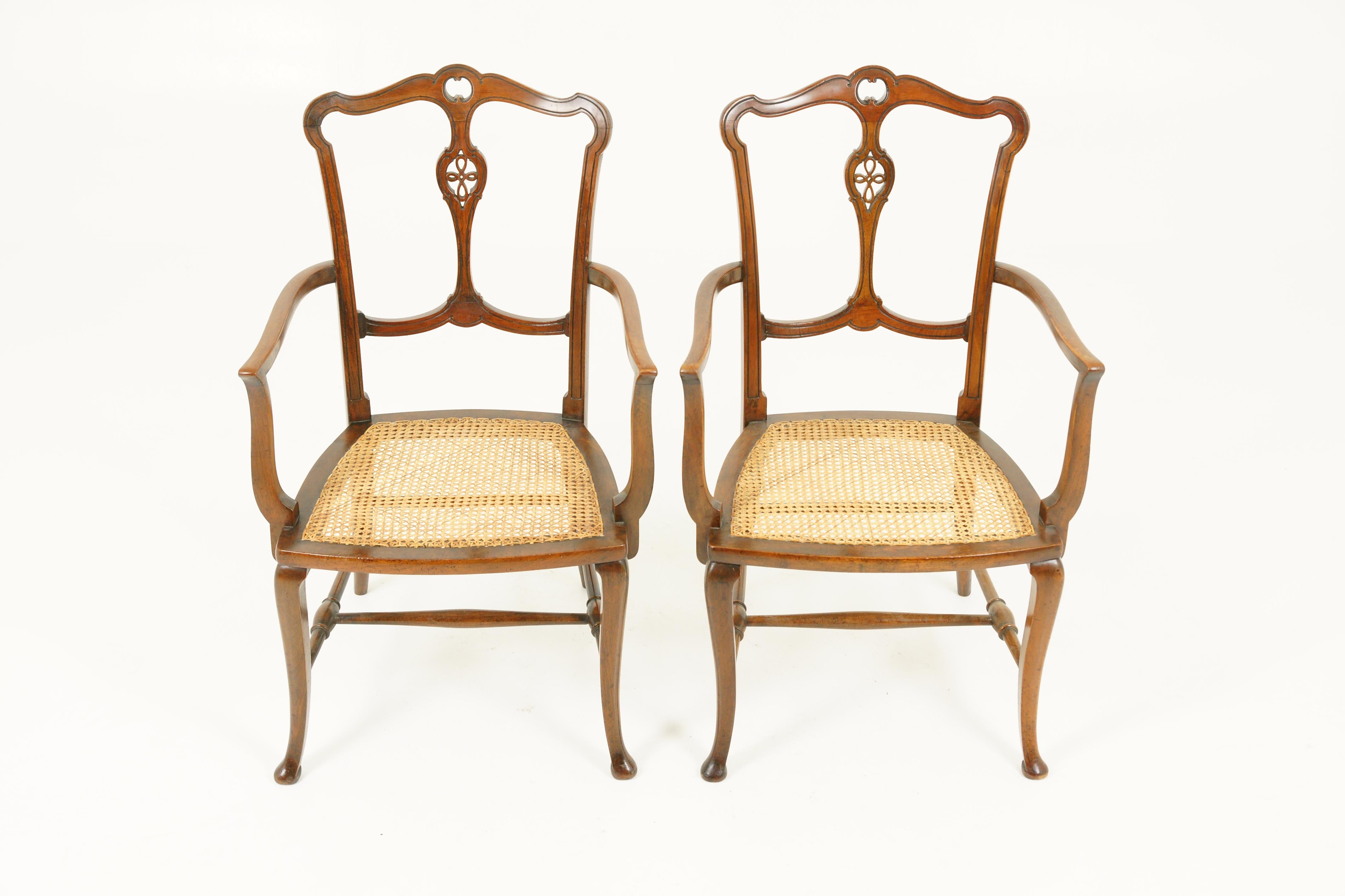 Antique Walnut Armchairs, Pair of Armchairs, Caned Seats, Scotland 1920, B1700

Scotland, 1920
Solid walnut with caning
Shaped top rail
Carved single slat underneath
Out swept shaped arms
Original caned seat
Ending on cabriole legs
Connecting