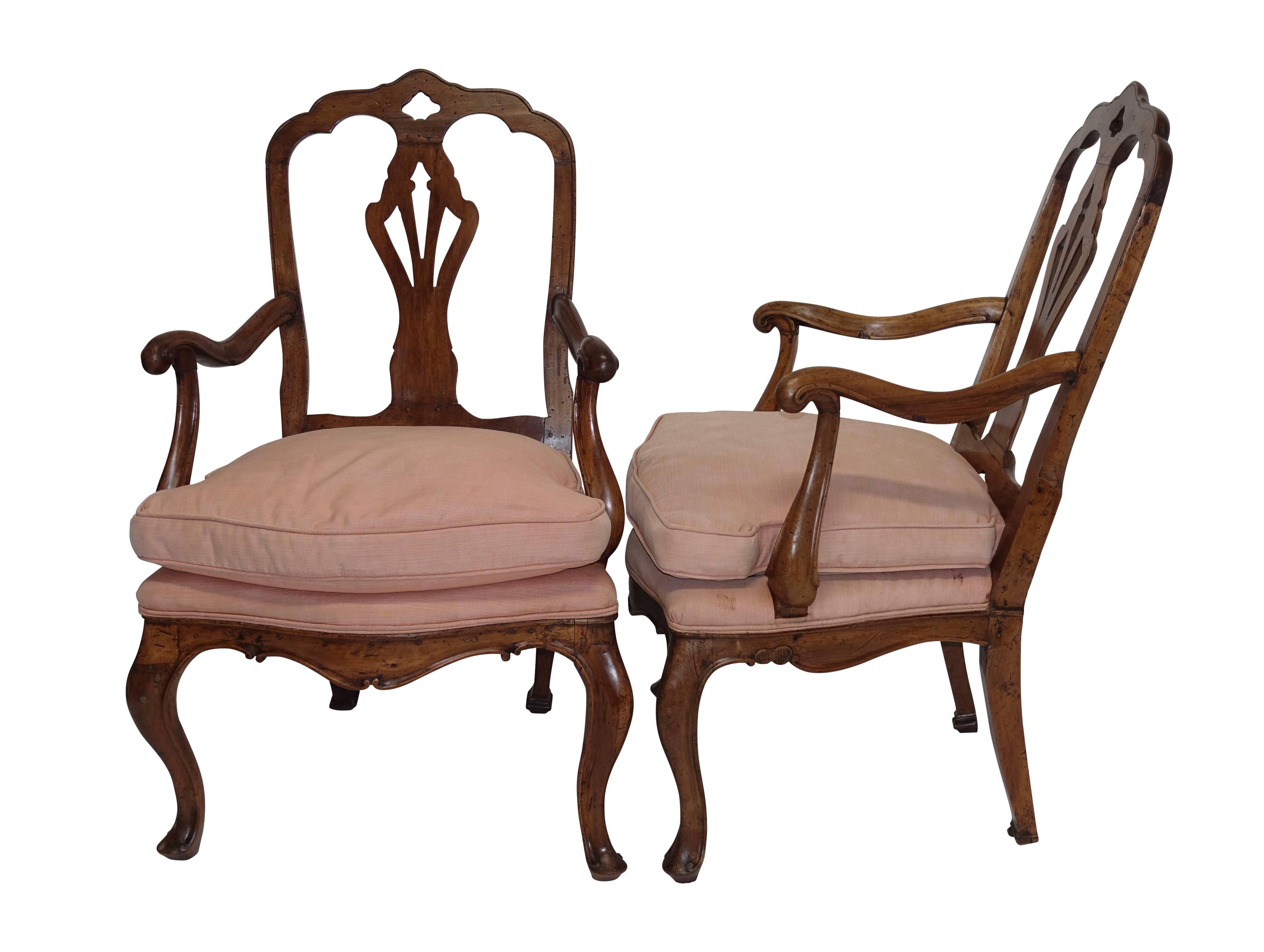 A handsome pair of walnut armchairs with shaped crest rail above carved back splat, having scrolling arms, and sitting on cabriole legs ending in a scroll footpad. The loose cushions are down filled, Italy, early 19th century.
Piedmontese, possibly