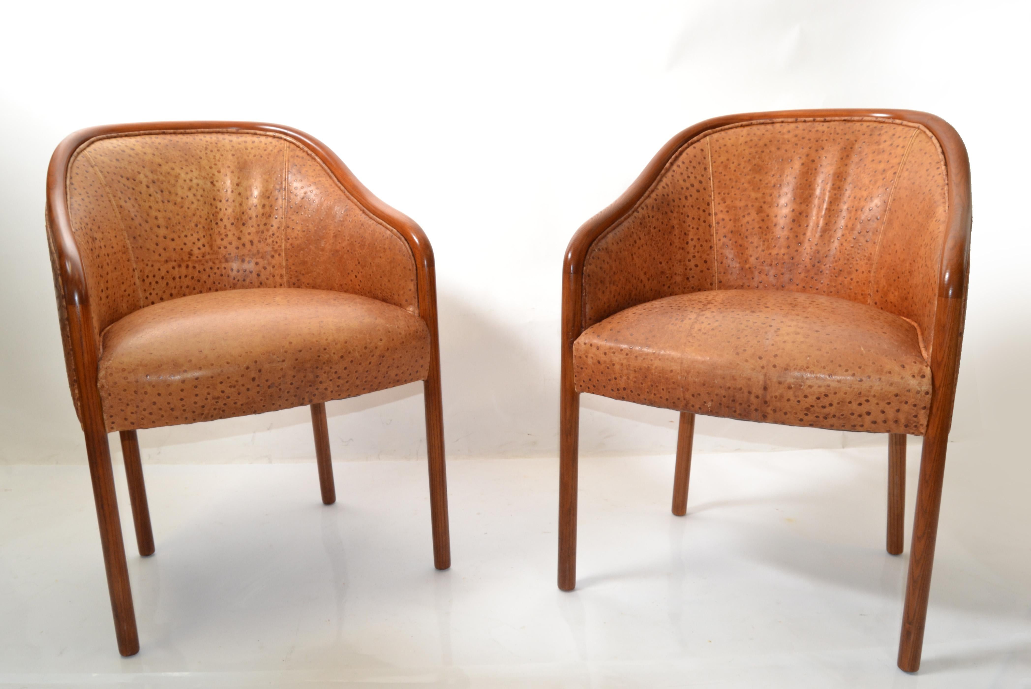 Rare find this pair of Ward Bennet oak armchairs with the original cognac brown Ostrich leather upholstery made by Brickel Associates in the late 1970.
The oak wood frames have been refinished and the leather shows some age related scratches and