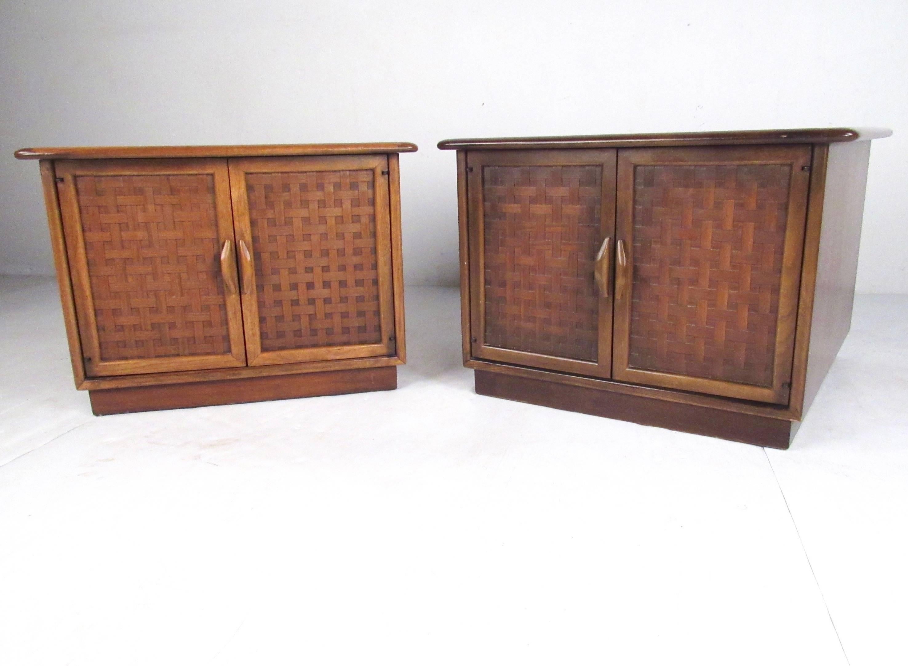 This stylish pair of vintage walnut end tables features basket weave fronts as designed by Warren Church for Lane Furniture. Spacious storage cabinet makes these vintage modern lamp tables with carved door pulls a unique Mid-Century Modern addition