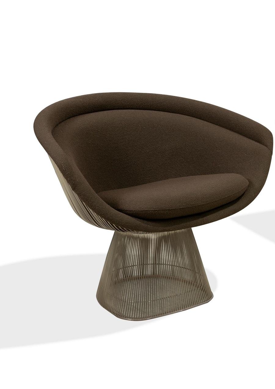 Pair Warren Platner lounge chairs. The chairs have brown upholstery with a nickeled steel frame.