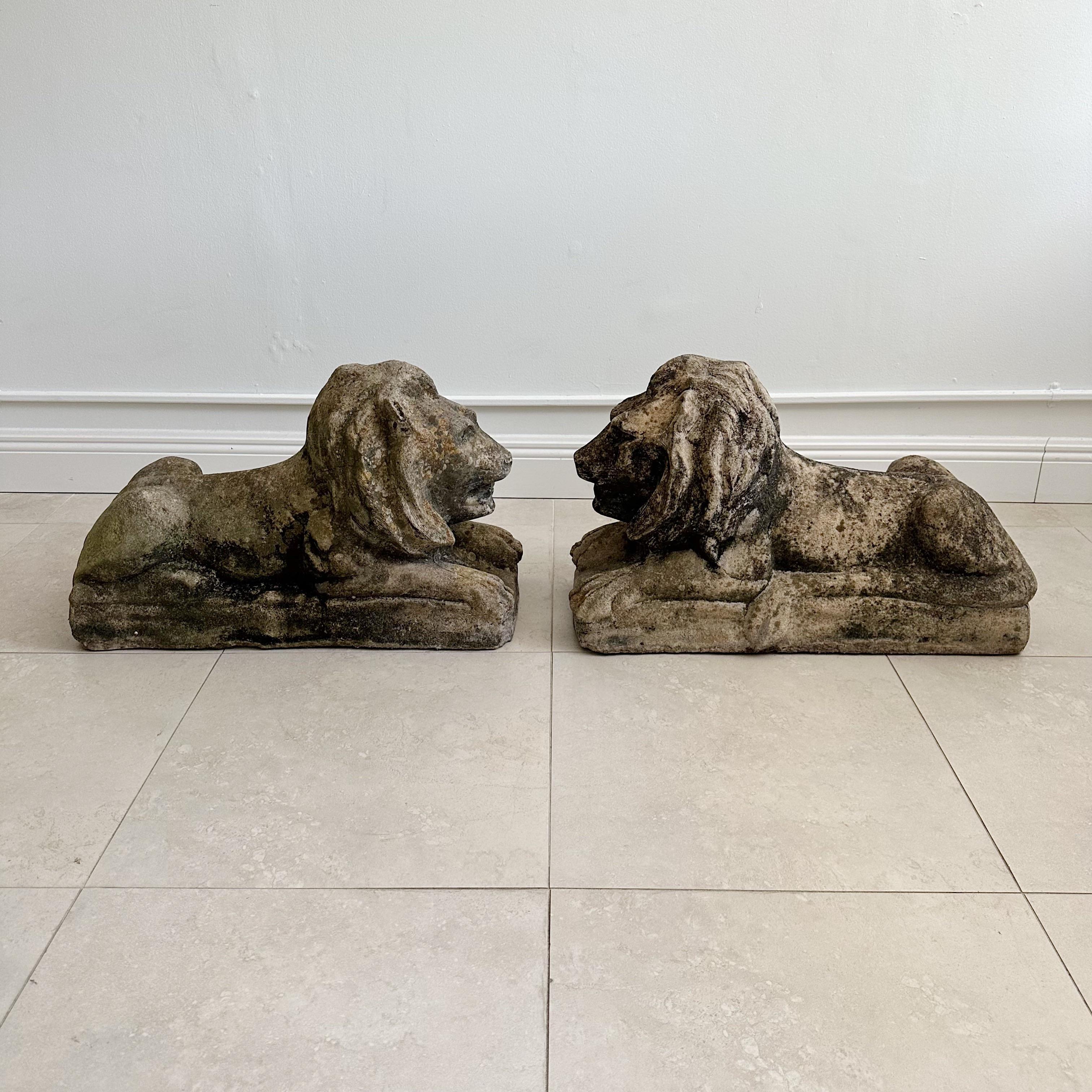 Pair Weathered Concrete Outdoor Reclining Garden Lions Circa 1950's In Good Condition For Sale In West Palm Beach, FL