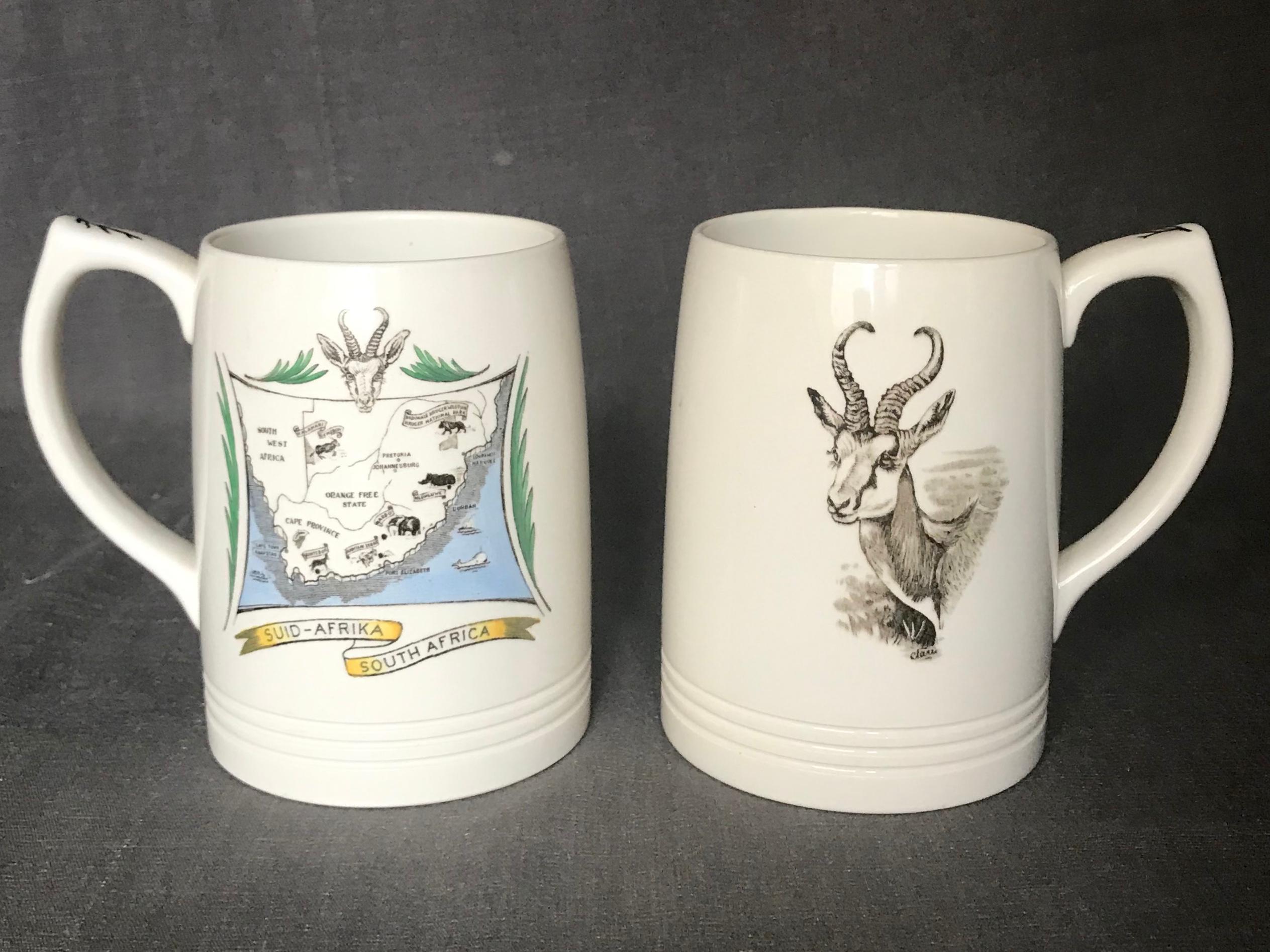Pair of Wedgwood African safari mugs. Great gifting pair of vintage coffee mugs with a springbok and kudu and on the reverse a map of the 
South African provinces and local wildlife; commissioned by the Union of National Parks of South Africa,