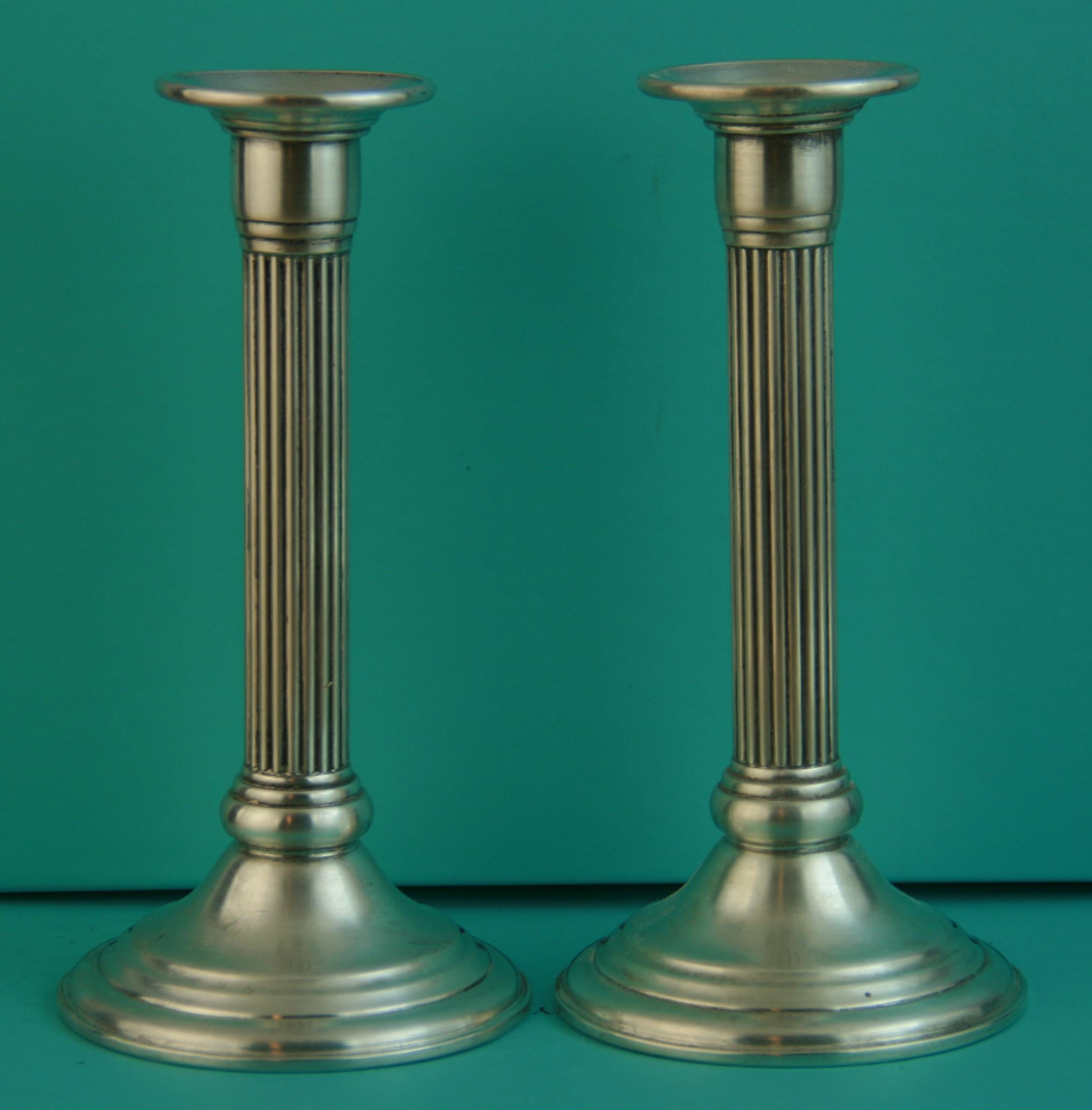3-958 Pair fluted weighted sterling silver candle sticks
Marked sterling on bottom with makers name.