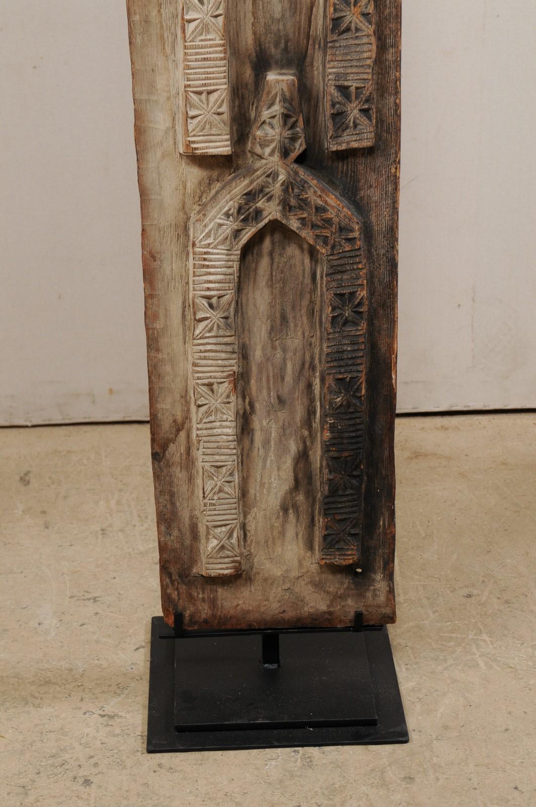 Pair of West African Carved-Wood Panels Raised on Custom Stands 1