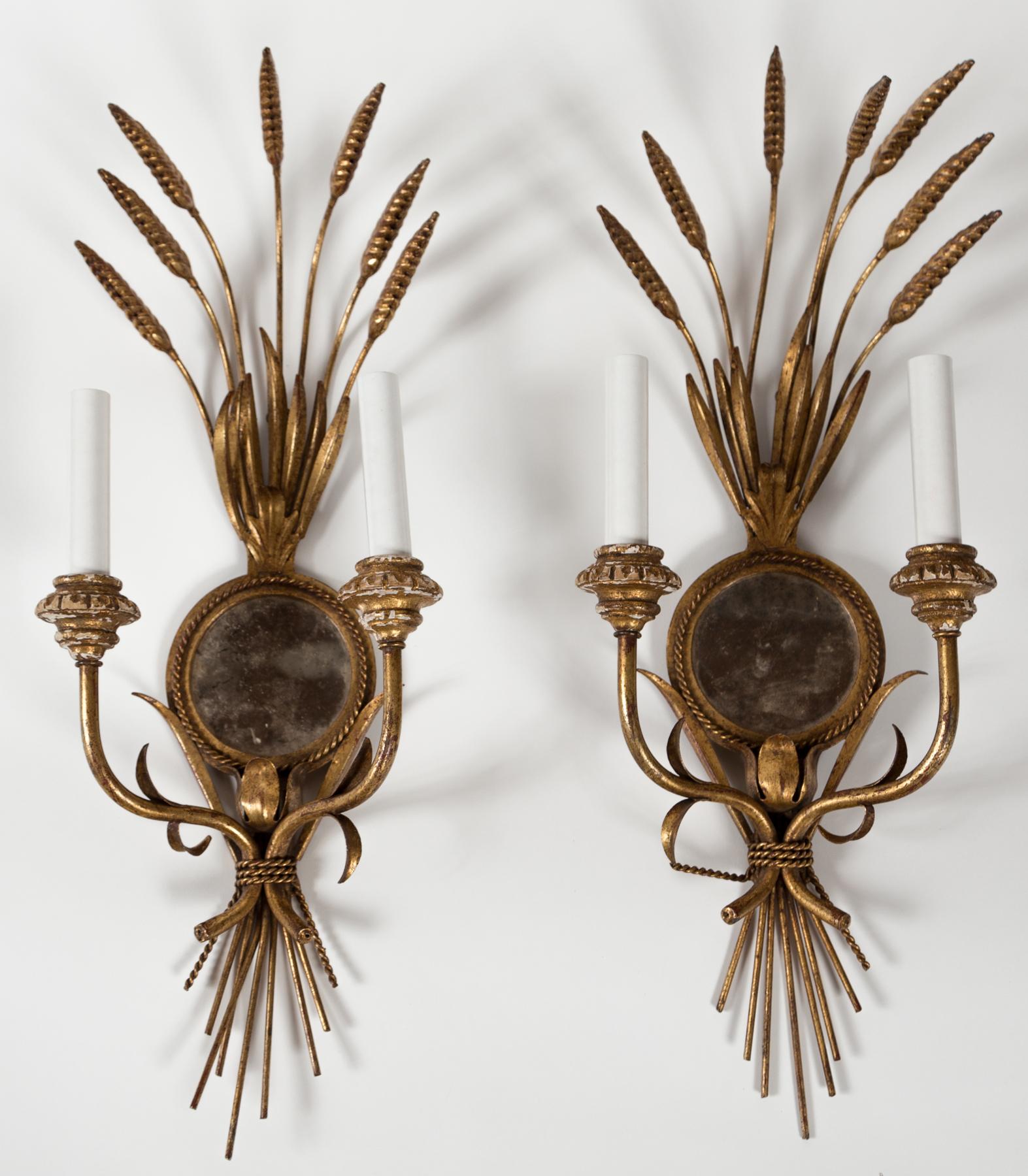 Pair Wheat Sheaf Mirrored Sconces, Italy, circa 1950's. Gilt metal with gilt wood details and antiqued glass mirrors. Double arms with new sleeves.