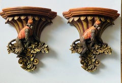 Coppia di stravaganti staffe da parete con statuette di servitori scimmia