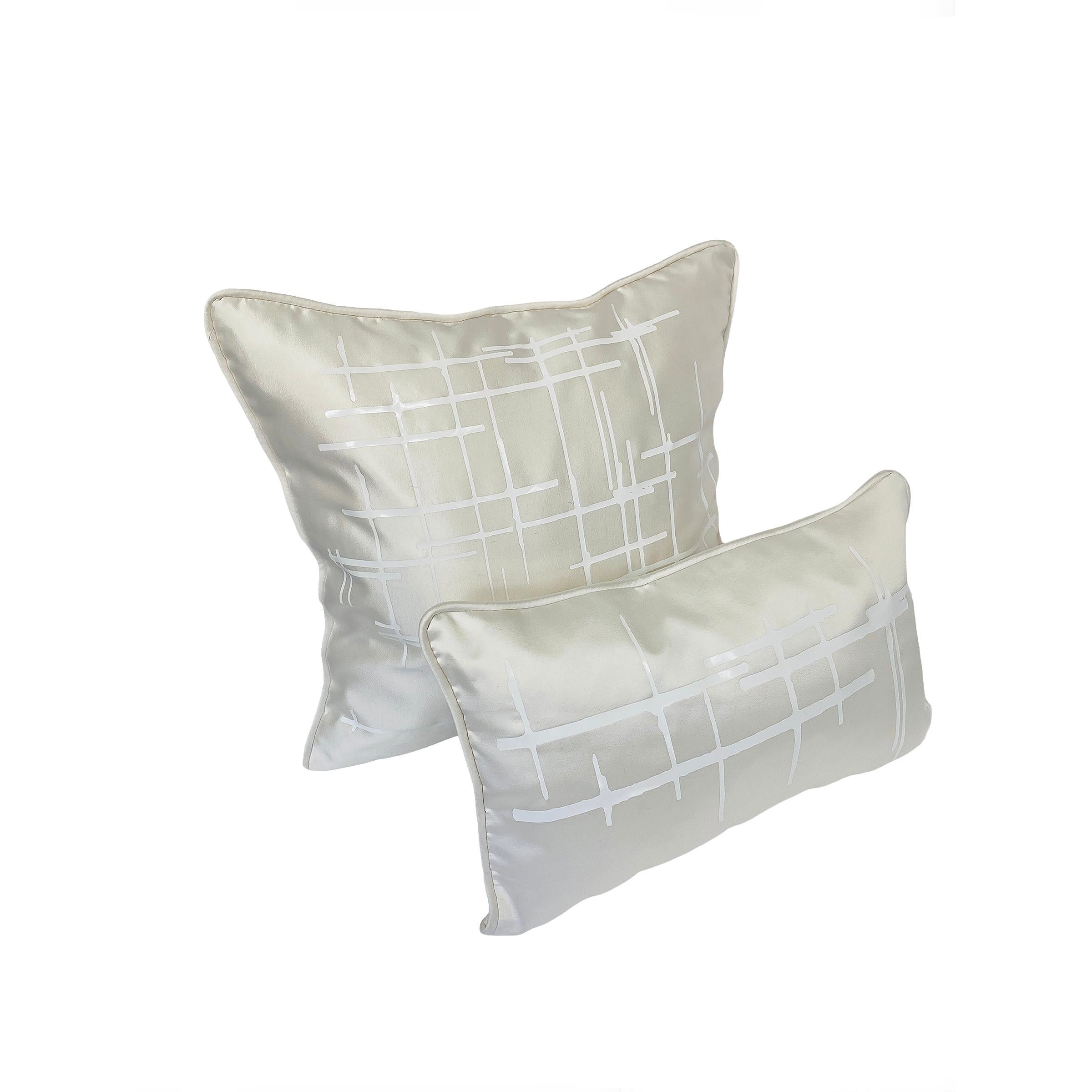 Authentic Italian silk wool in off-white. The luxury fabric is a blend of Italian virgin wool and silk, which makes for greater durability. This gives a perfect softness and sheen to the pillows, complementing any interior decor. The wool