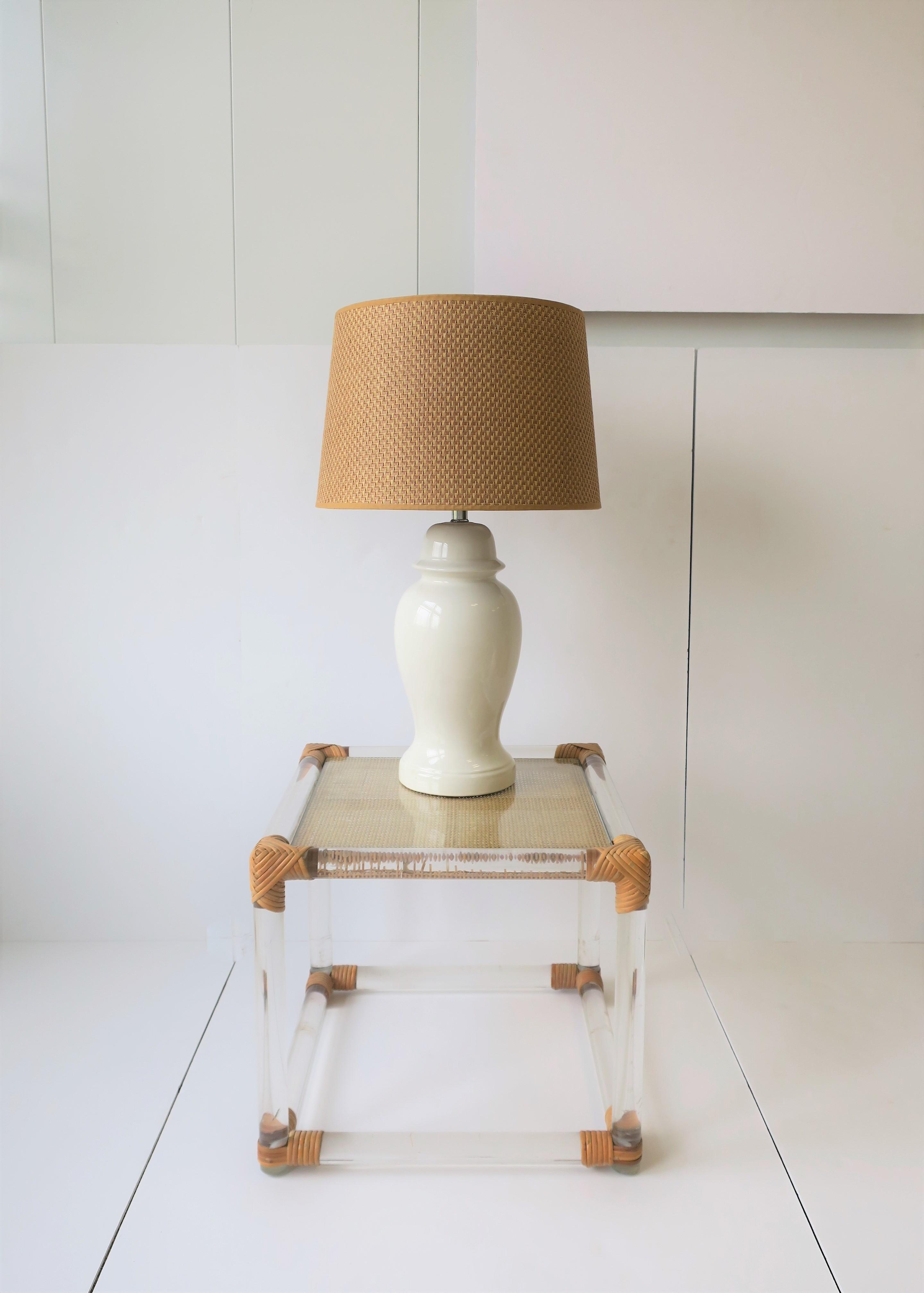 A great pair of vintage white ceramic ginger jar table lamps with wicker style lampshades, circa 1960s. With original tag as show in images #12 and 13. 

Measurements:
25