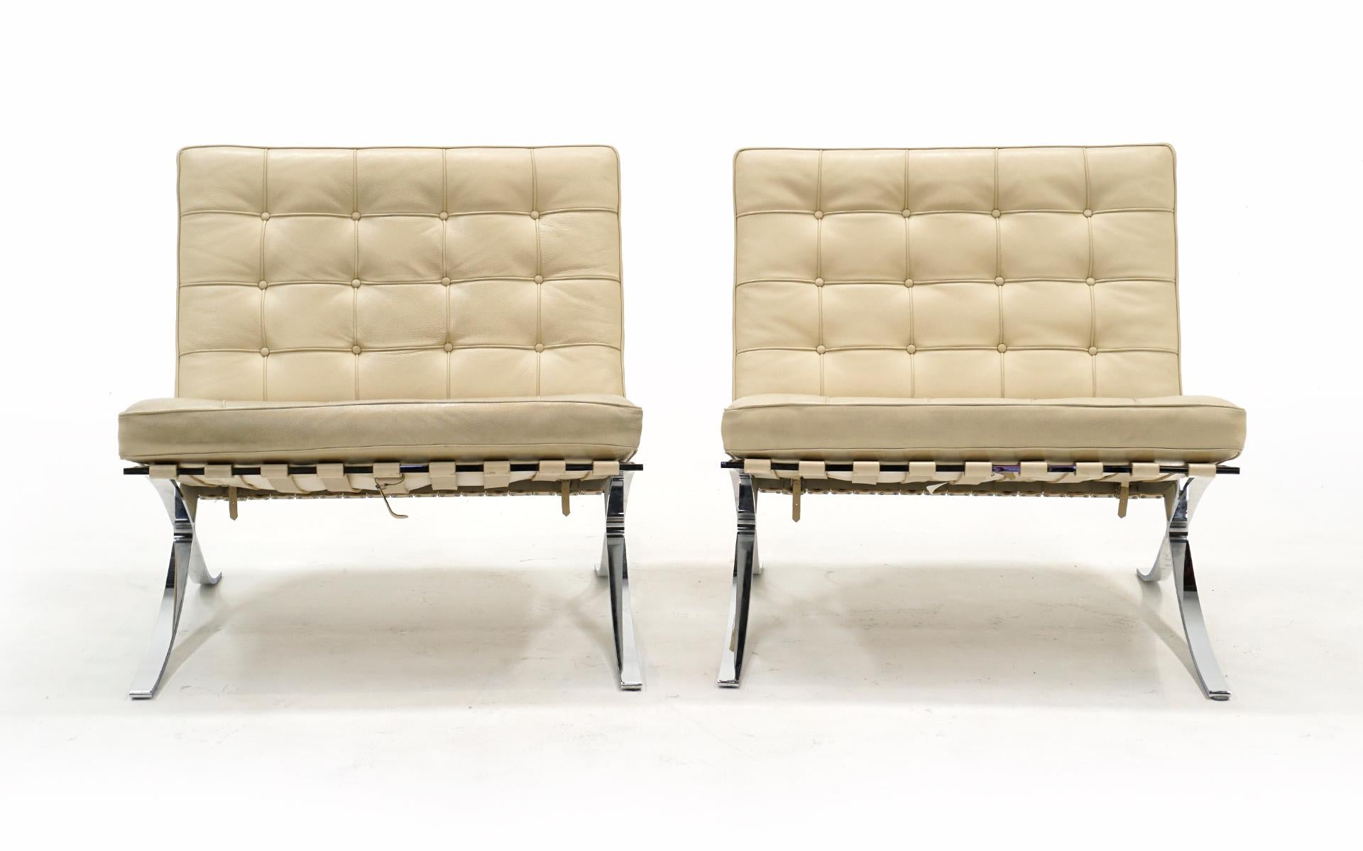 Pair of off white / ivory leather Barcelona Chairs designed by Ludwig Mies van der Rohe for Knoll. This pair is in the original leather in very good condition. No holes, tears or repairs. The chromed steel frames have scattered light scratches buy