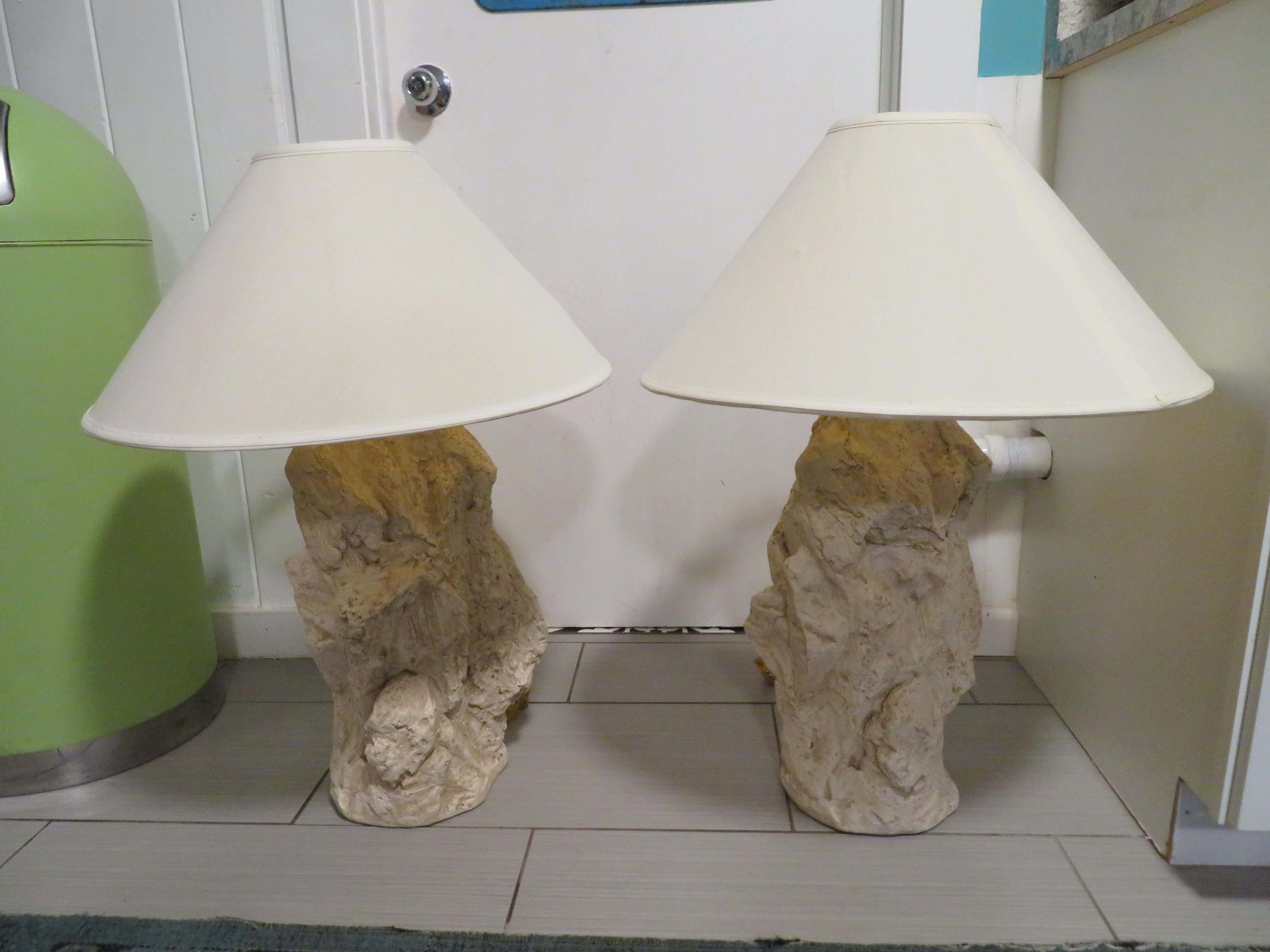 A pair of vintage American plaster table lamps attributed to Sirmos. This pair of plaster table lamps each feature a modern, quarry rock or brutalist design. The lamp bodies are made of plaster, have a neutral white and cream coloring. They retain