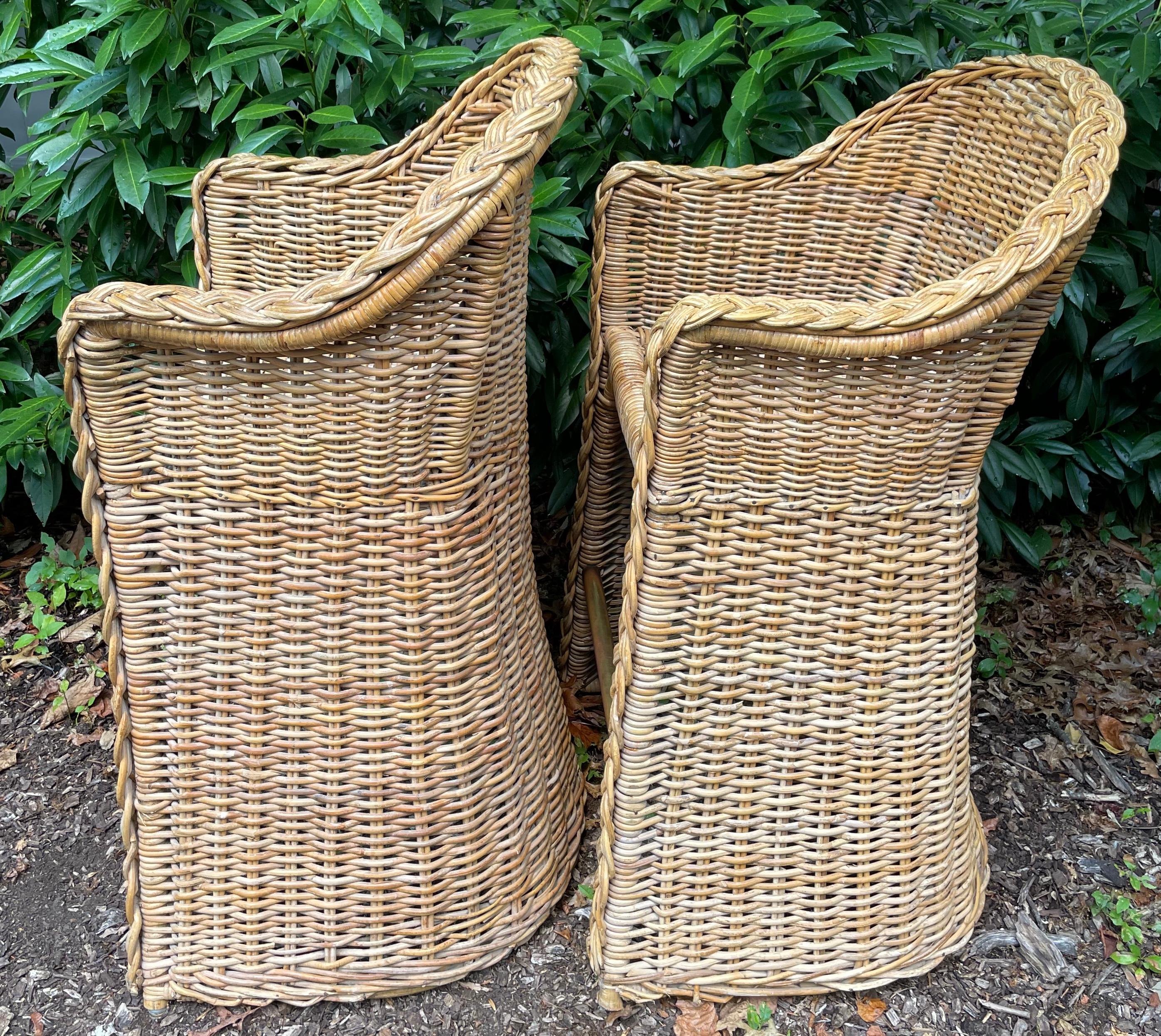 Pair wicker bar stools. Pair well made vintage wicker bar/counter stools with conforming arms and a brass rail foot rest in natural mellowed wicker. United States, Mid 20th century.
Dimensions: 42.5” H x 24” W x 23.5” Deep; seat height 27.5” H x