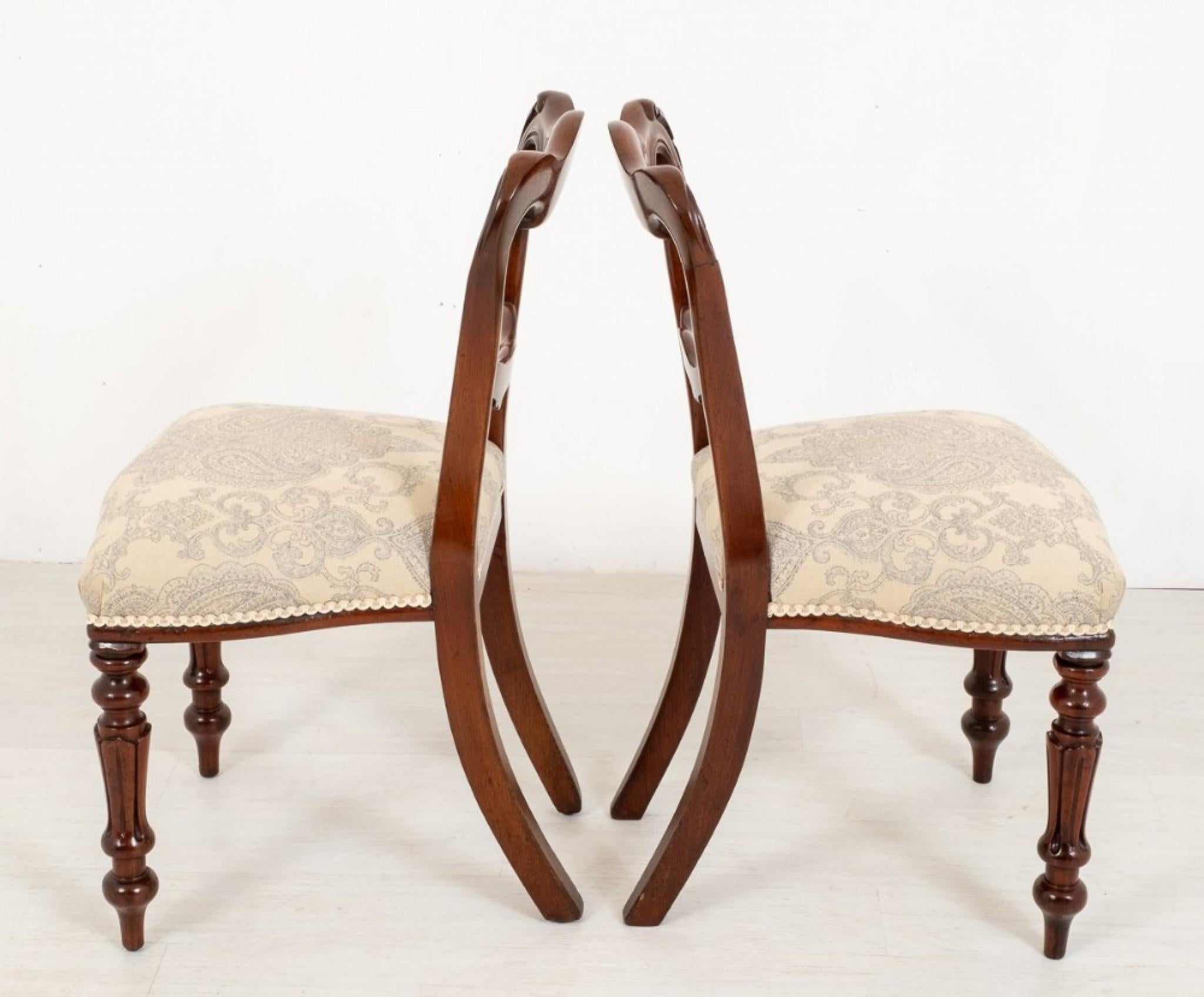 antique chair with wheels on front legs