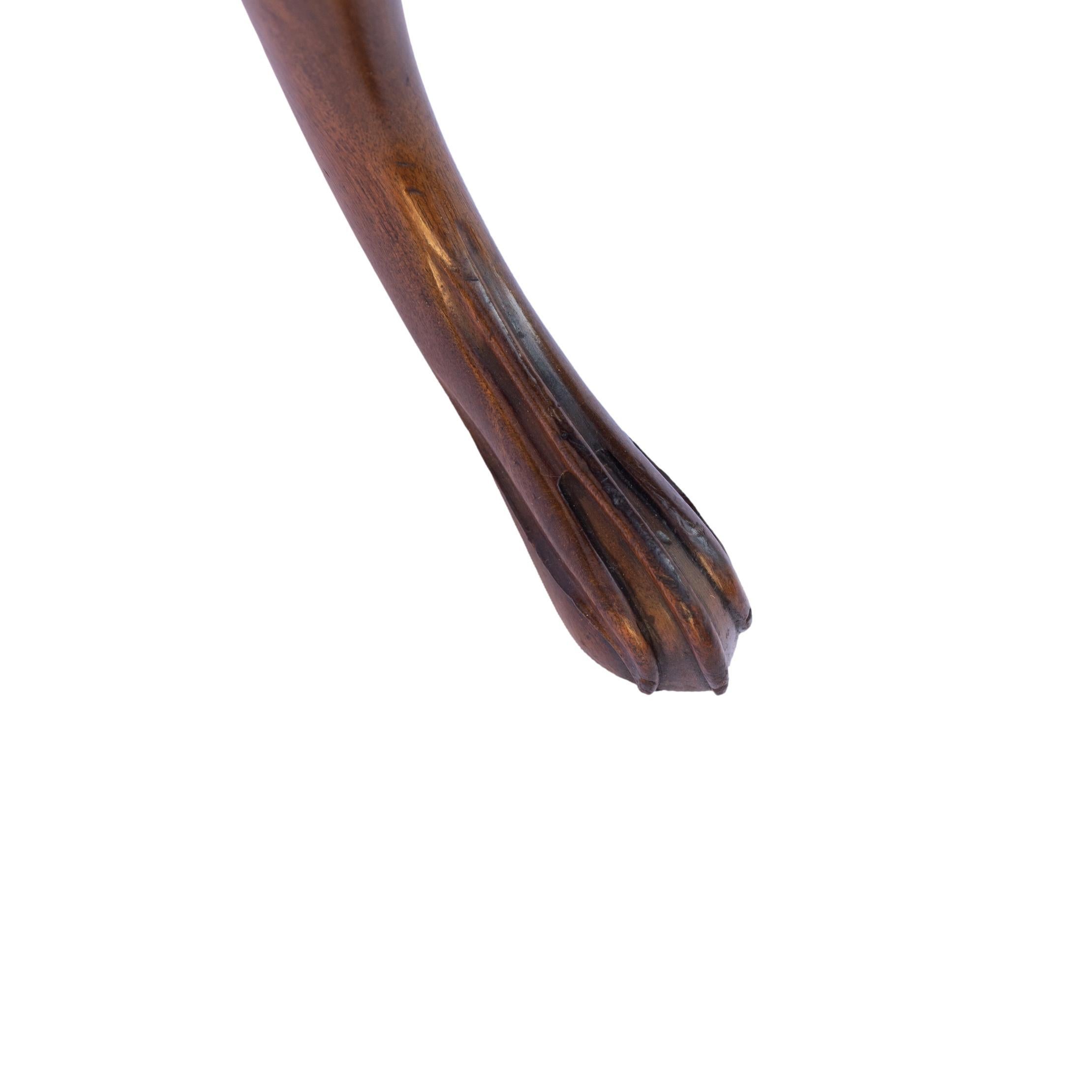 PAIR of Willian IV Solid Mahogany Wine Tables, the circular tops formed from a single timber, with molded edge, on a tripod base, the notched and carved posts above three intricately carved legs terminating in carved paw feet, English, ca. 1840.
The