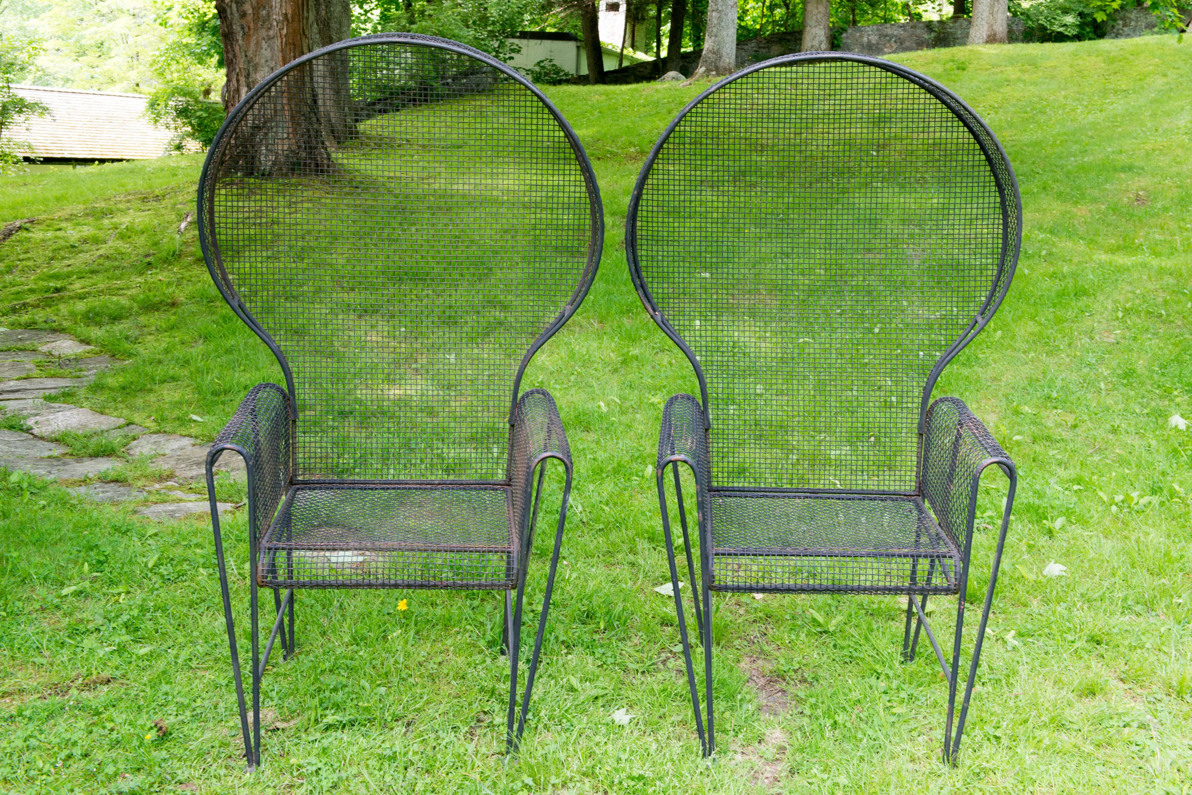 Pair of vintage monumental Mid-Century Modern Russell Woodard canopy arm chairs in the Sculptura line. Stunning for pool side or garden. For over 150 years, 
Woodard has been one of the industry leaders in classic outdoor patio furniture design and