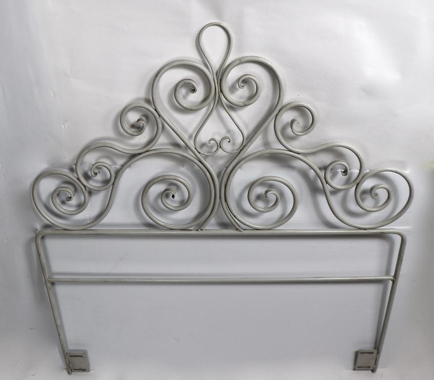 Well crafted pair of   scrollwork wrought iron headboards suitable for twin size beds ( 44 inch total W. ) You can use these as two separate headboards by attaching a Hollywood frame to each, or create one bed / daybed by using one as a headboard