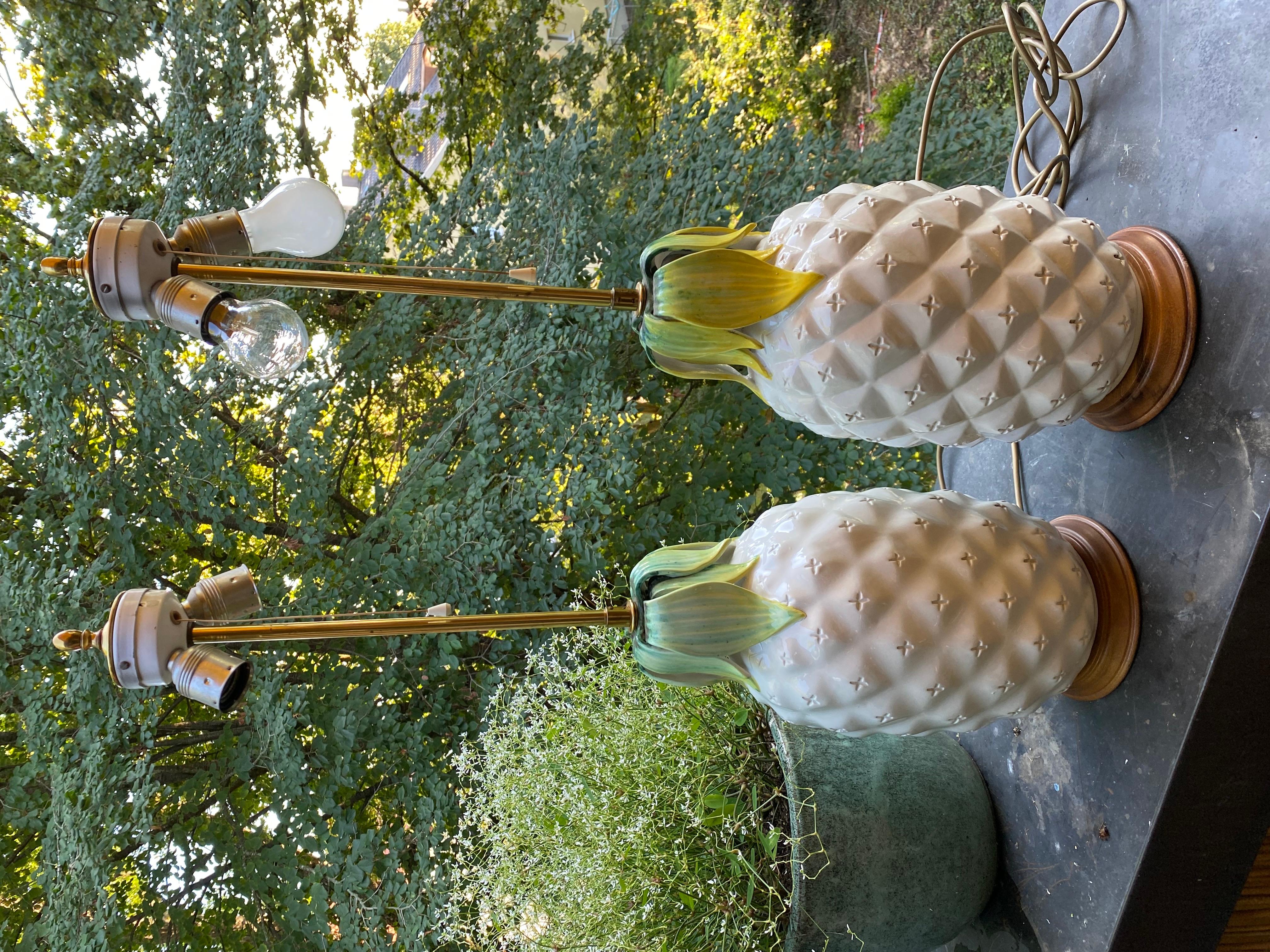 This magnificent set of two large table lamps was hand crafted from terracotta has a glazed ceramic finish. 

Impressive in size and hailing from Italy in the 1960s, each lamp was hand-made resulting in minor differences in the coloring of the