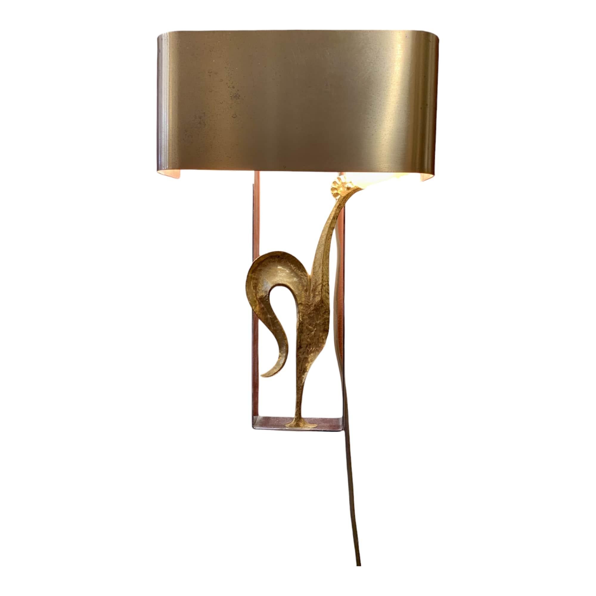 This delightful pair of wall lights, “Coq” model, is a true treasure from Maison Charles. Made from gilded brass, these stunning antiques from France were designed around 1970. Their elegant and refined design will bring a touch of sophistication to