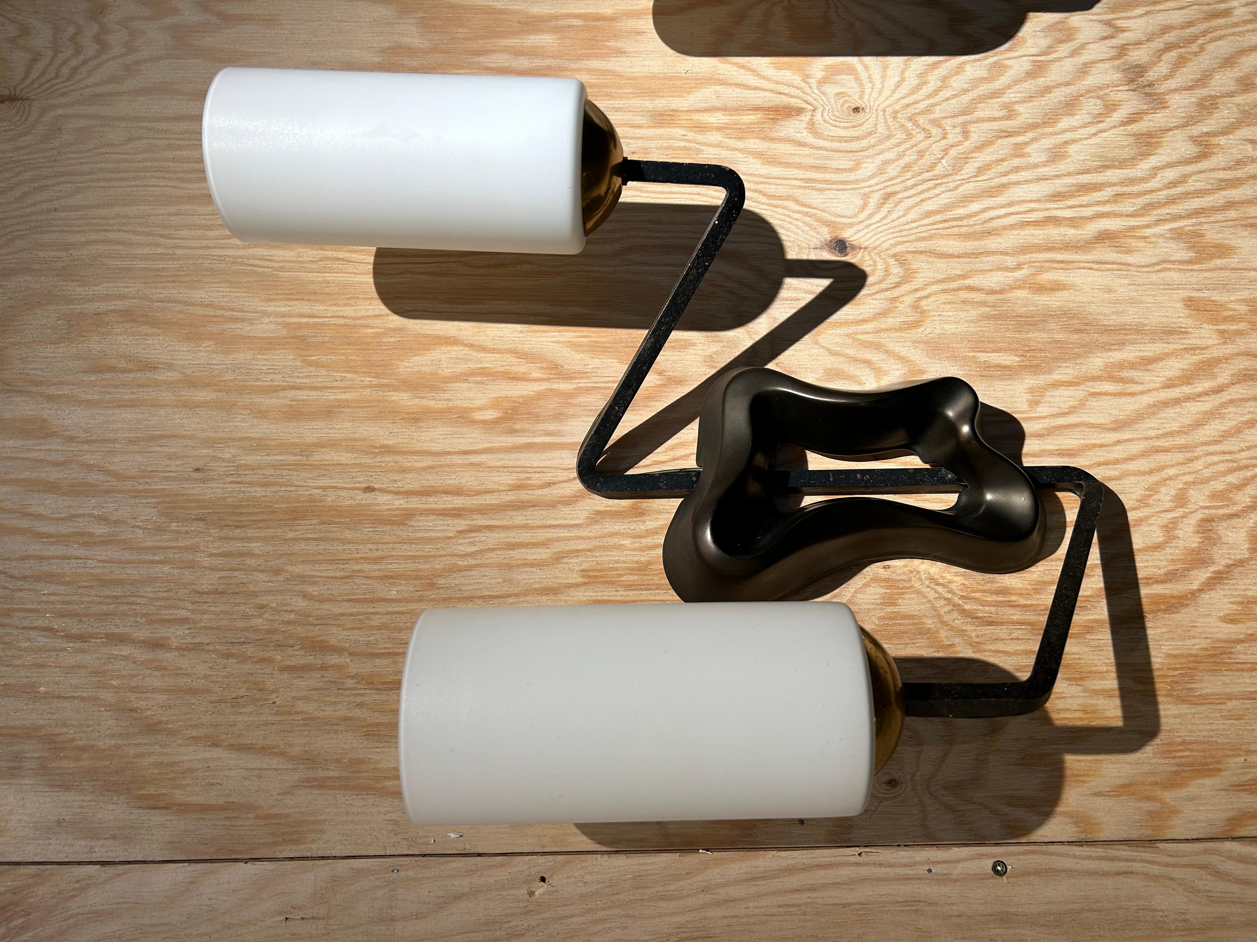 Georges Jouve pair of wall lights
Editor Marcel Asselbur
 circa 1950s
 Ceramic, brass and iron and glass 
Including lamp shades in glass
 