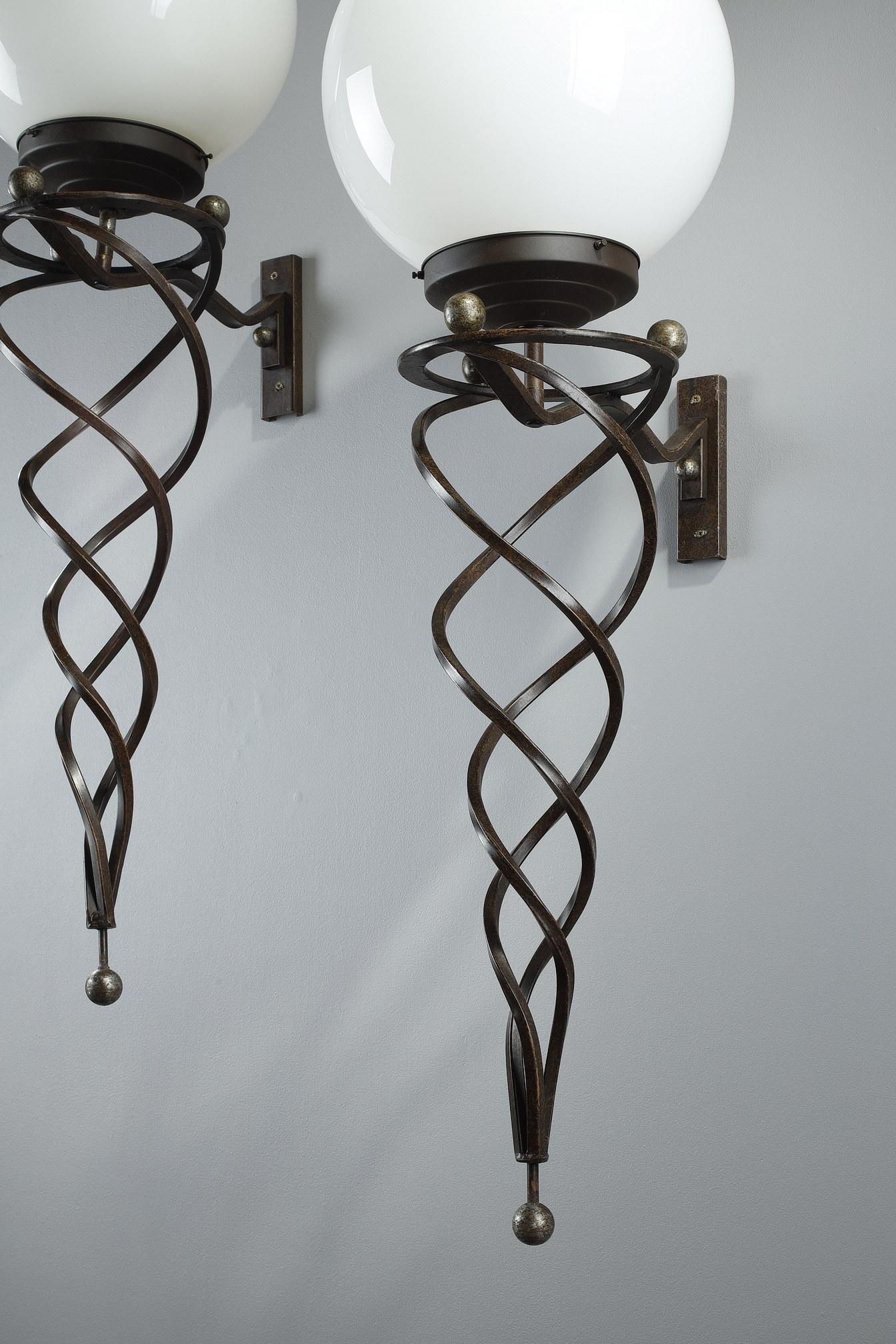 Patinated Pair of wrought iron Art Deco sconces For Sale