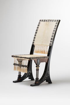 Pair of chairs 1900 by Carlo Bugatti in parchment, blackened wood, and trimmings