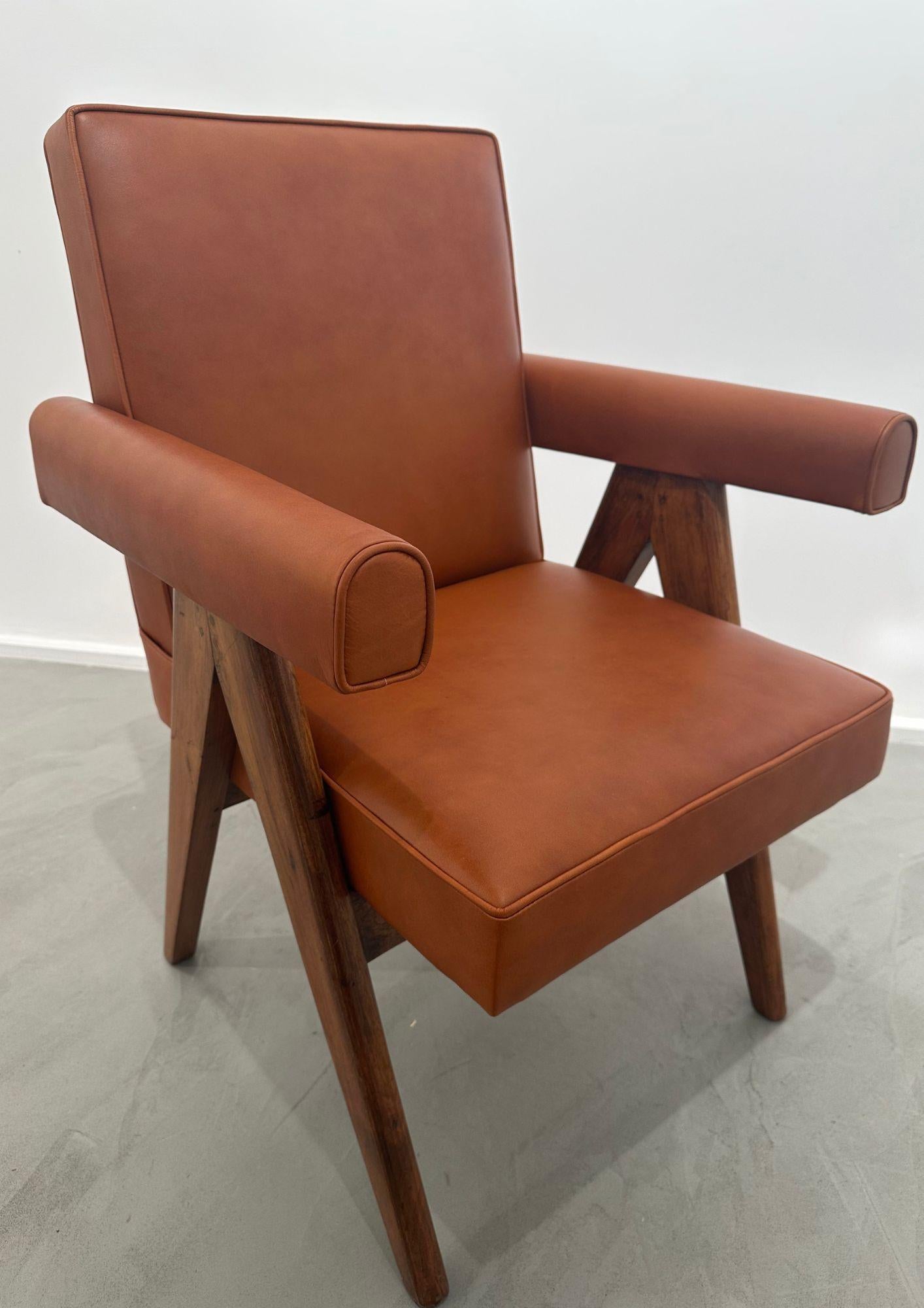 Solid teak and leather armchairs with compass legs by designer Pierre Jeanneret.
Provenance: Chandigarh, India