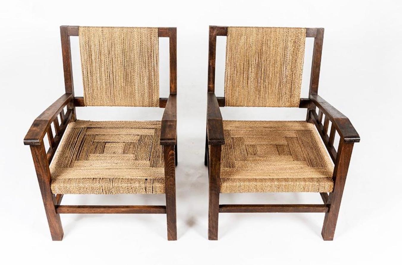 Pair of Francis Jourdain armchairs 1925 , oak frame, rope back and seat. Exhibited at the Centre Pompidou in Paris Very good condition