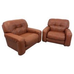 Paire de fauteuils lounge vintage en skai des années 60 70