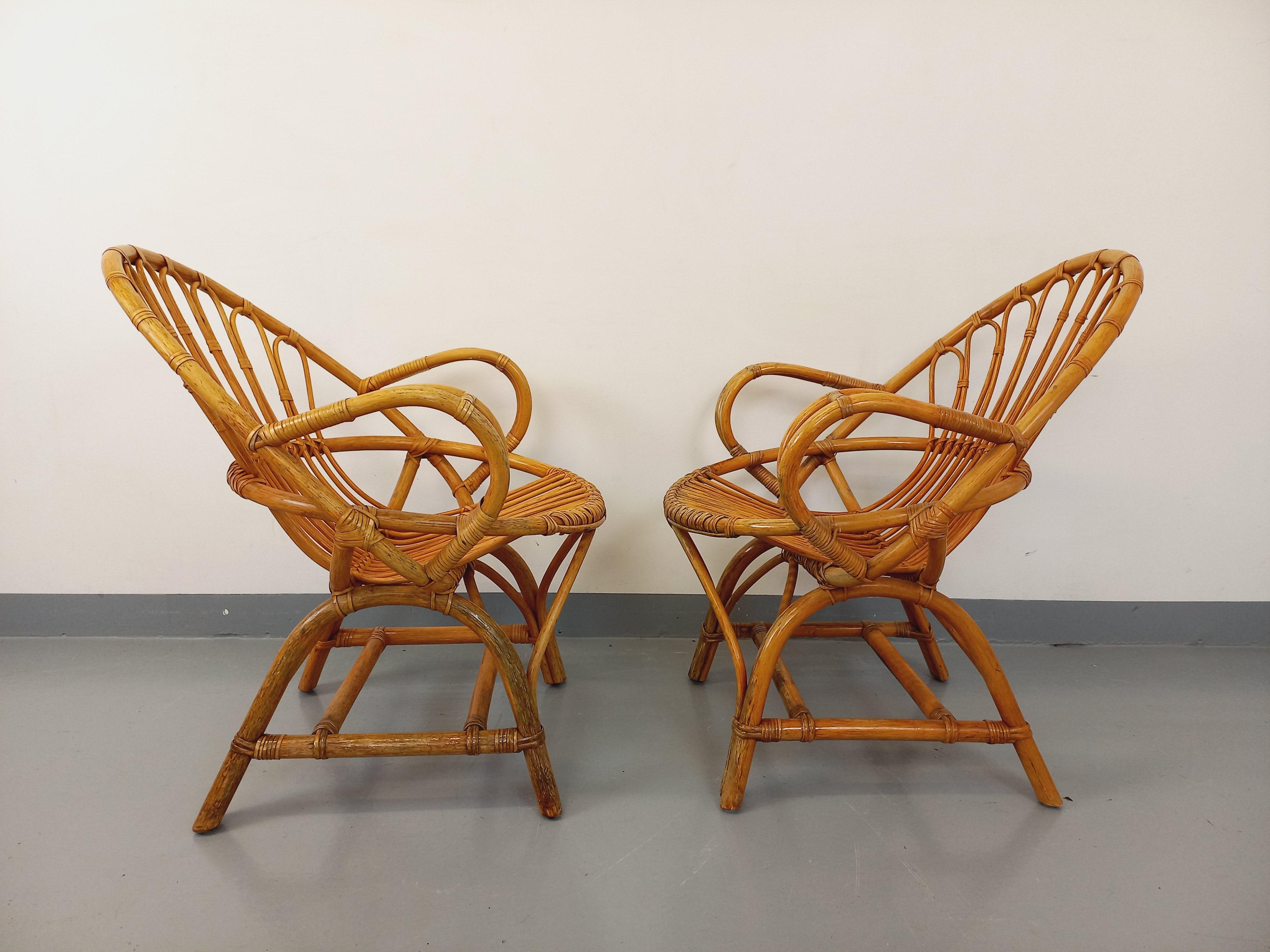 Paire de fauteuils vintage en rotin des années 60 en venta 7