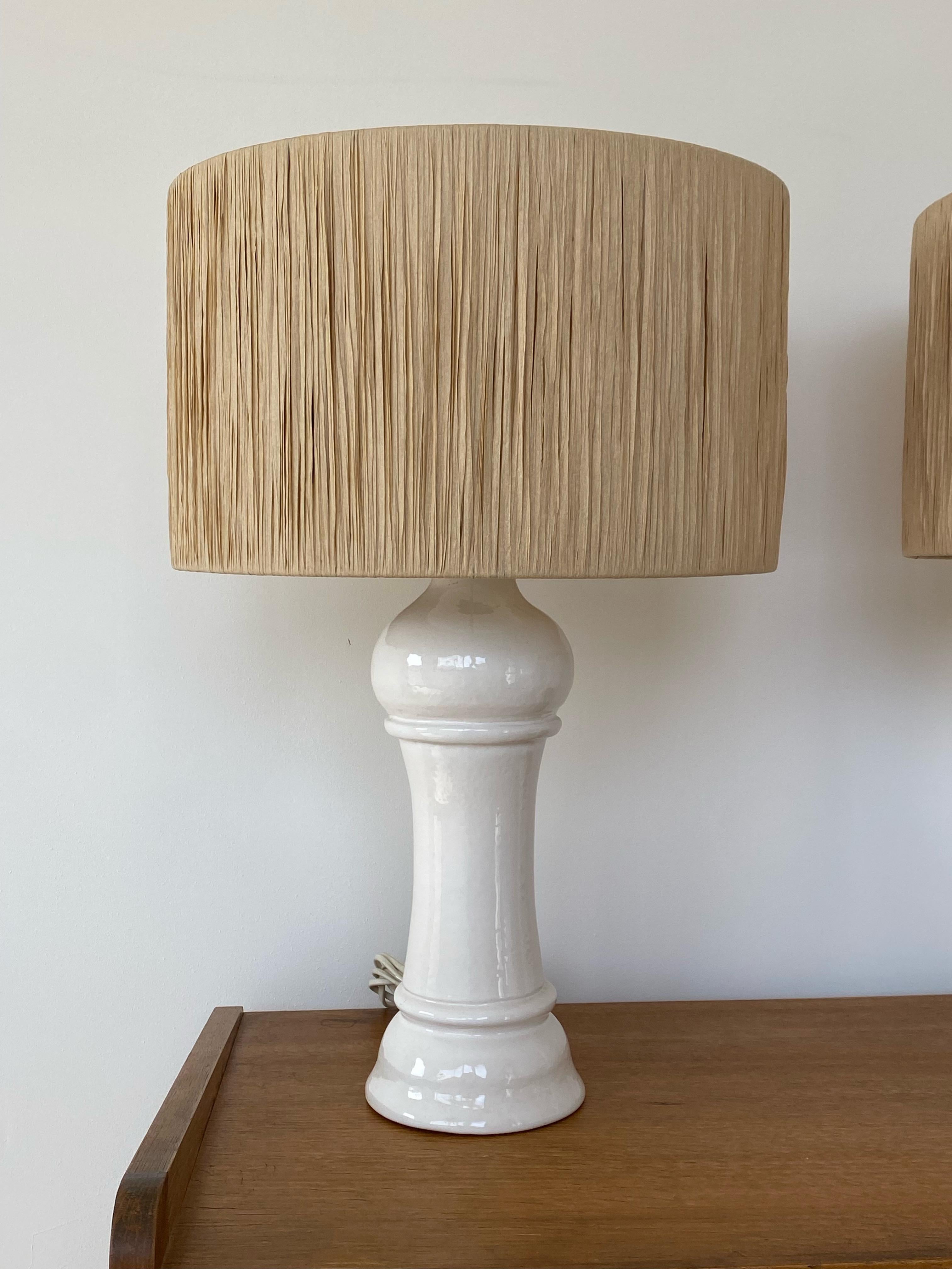 Italian Pair Of White Ceramic Lamps With Raffia Shade, Italy, 1960s For Sale