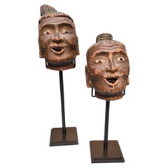 Paire de têtes de marionnettes chinoises sculptées et peintes fin 19ème siècle