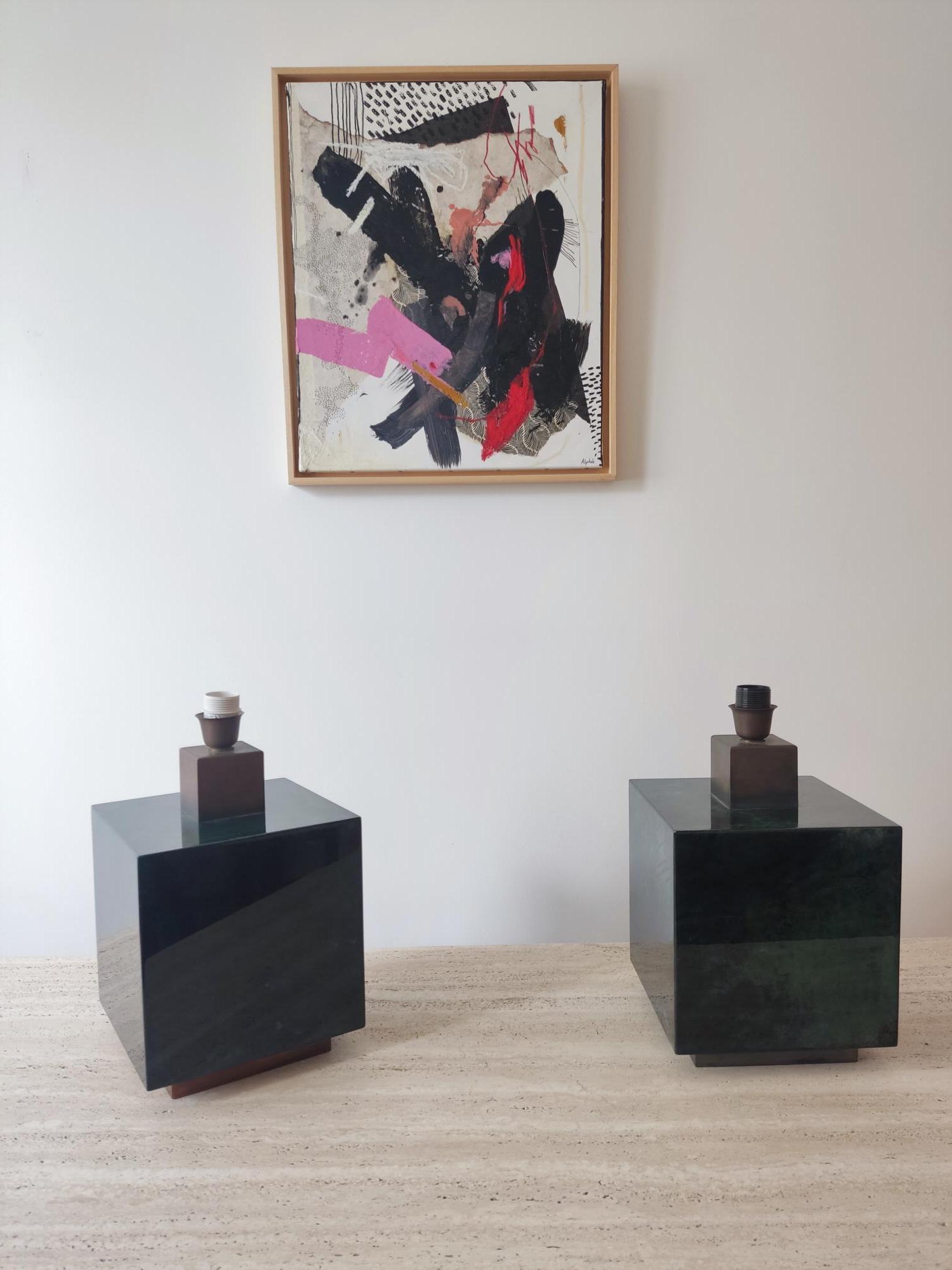 Elegant pair of Italian lamps from the 1960s attributed to Aldo Tura. The body, square in shape, is lacquered in a gradient of greens. It rests on a brass base found at the head. The lampshades are new.

