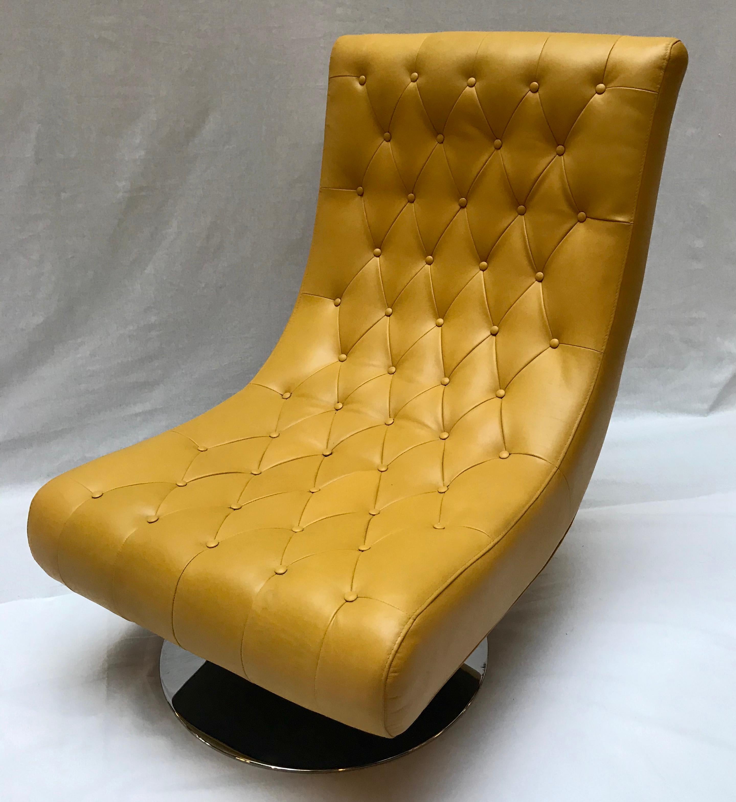 A pair of armchairs in yellow Hermès leather and chrome foot

re-upholstered.

   