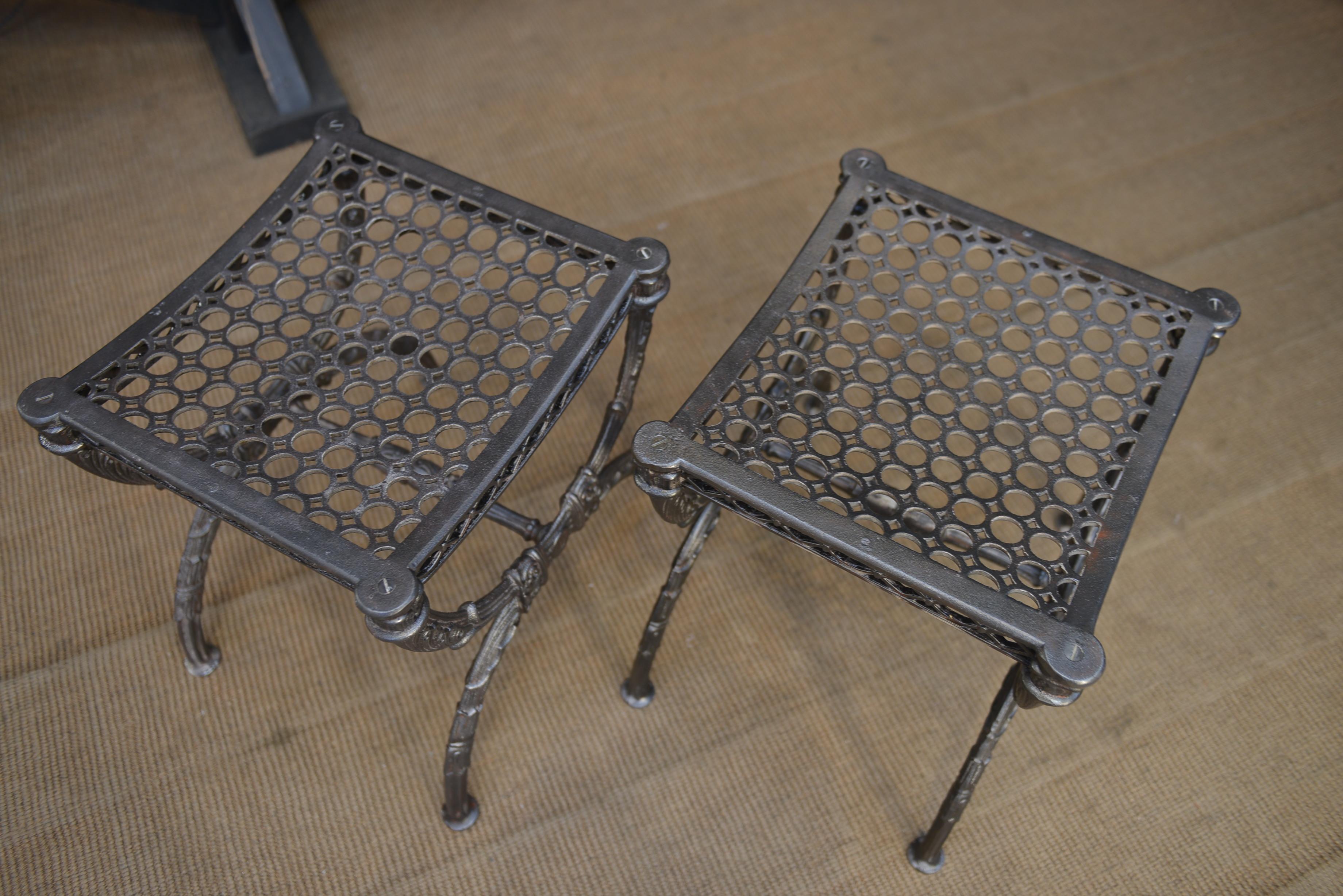 Paire of great quality cast iron stools with very nice details on curved led and seat, France, circa 1900 . Weight 15 kg each 