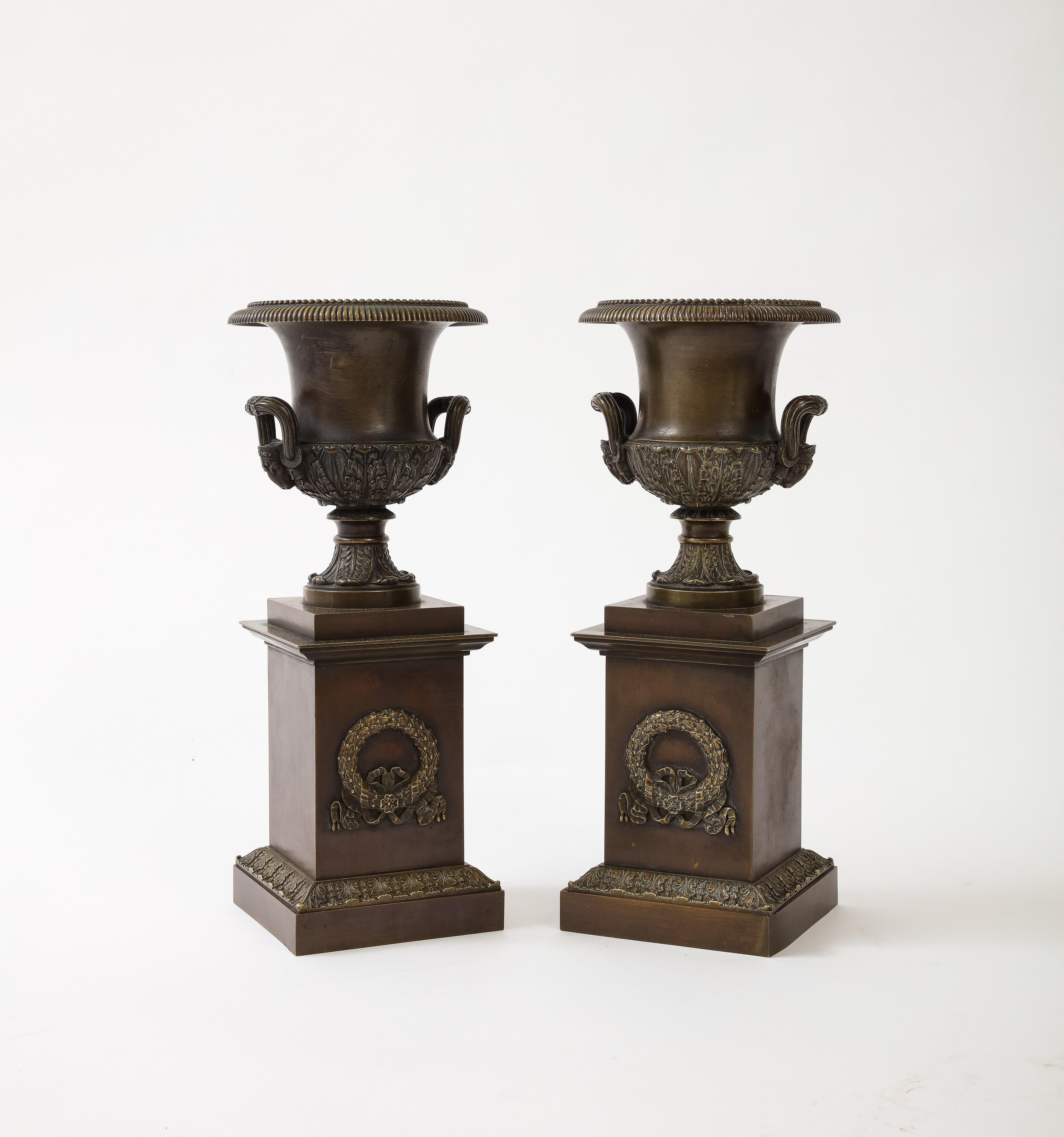 French Pair of Patinated Bronze Empire Period Medici Urns For Sale