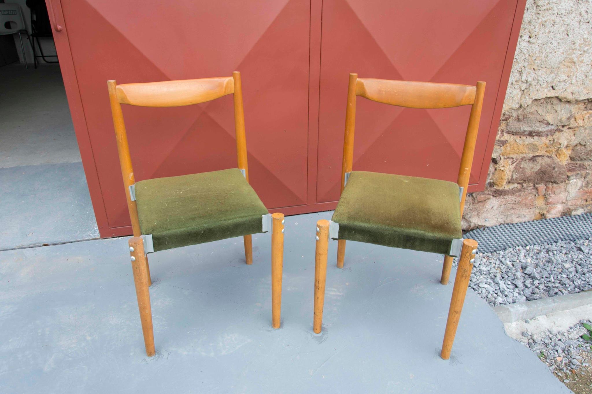 Pair of upholstered dining chairs by Miroslav Navrátil. They were made in Czechoslovakia in the 1970s. It features a beech wooden and metal structure with a suede fabric. The chairs are in good original condition with signs of age and use. Price is