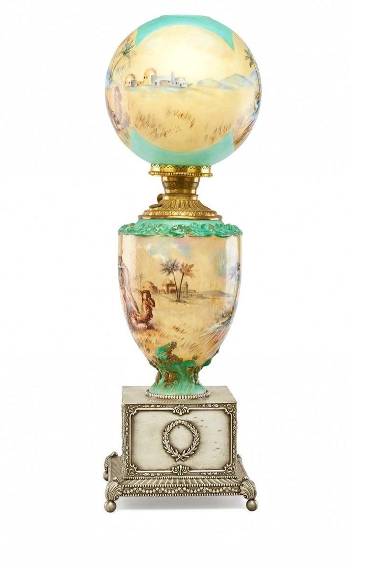 Pairpoint Monumental Hand-Painted Orientalist Oil Lamp, Pyramids, Palms c 1905
Rare oil lamp, USA, c. 1905. obverse-painted glass, patinated metal
Measures: 33½ height × 10 diameter in (85 × 25 cm) Provenance: Collection of Edward and Sheila