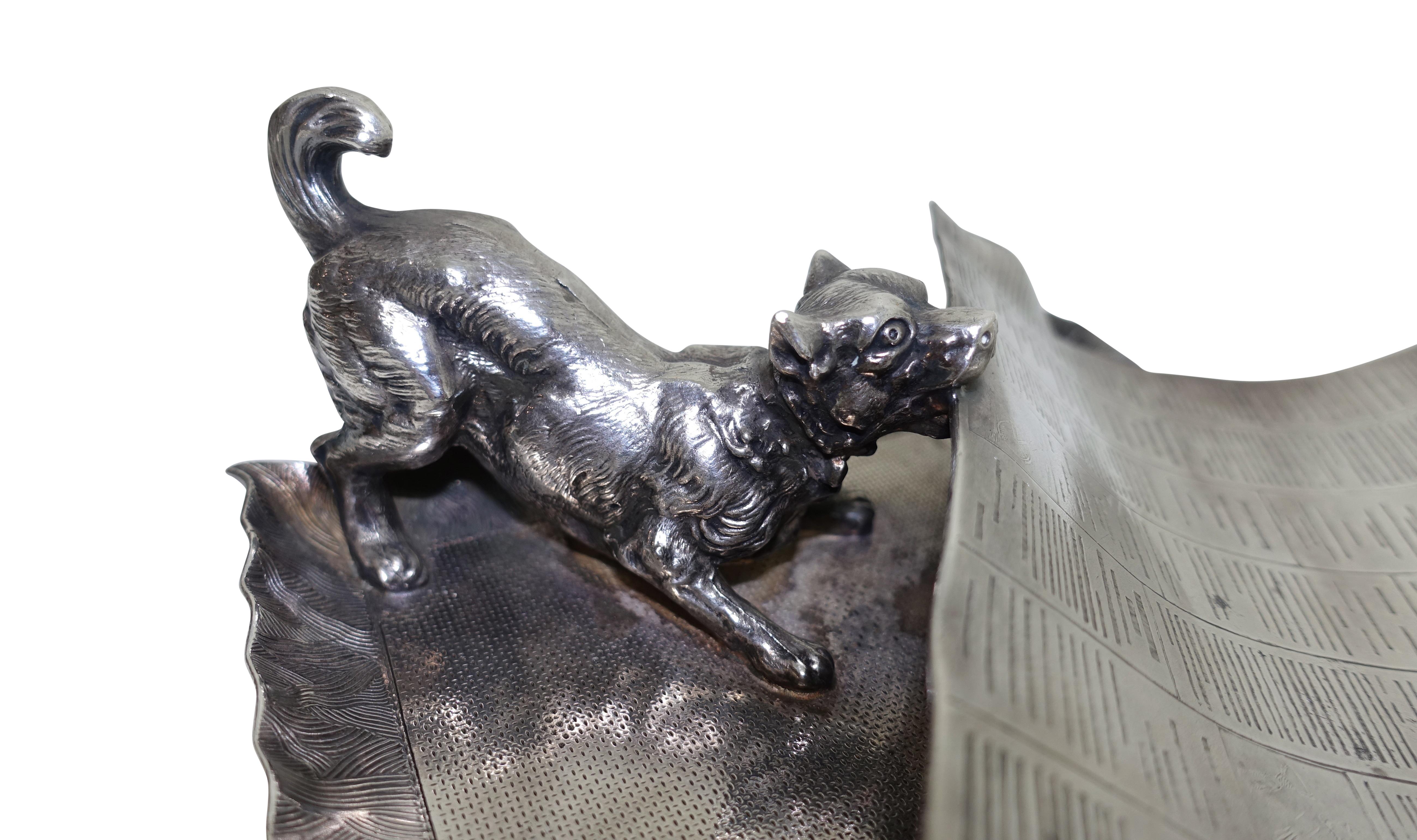 Charming antique silver plate calling card tray or business card receiver
A dog with a newspaper in his mouth
Made by the Pairpoint Mfg. Co., hallmarked on the underside,
late 19th century. 

 