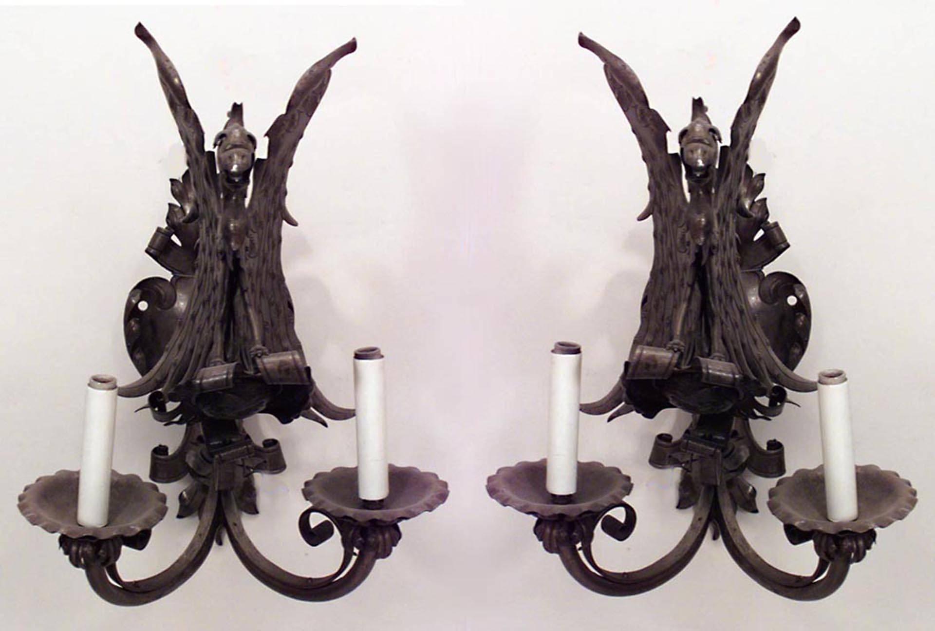 4 English Renaissance Revival (early 20th Century) steel wall sconces with two arms and a centered griffin perched above a coat of arms. (PRICED EACH)
