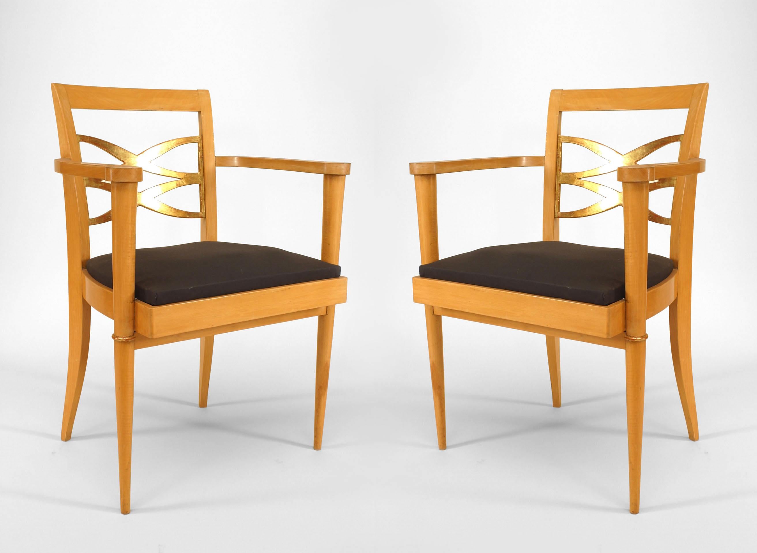 Pair of French 1940s sycamore arm chairs with open design gilded back & trim and slip seat attributed to BATISTIN SPADE. Two pairs - PRICED PER PAIR.


Batistin Spade (13 March 1891- November 16, 1969) was a interior architect and furniture