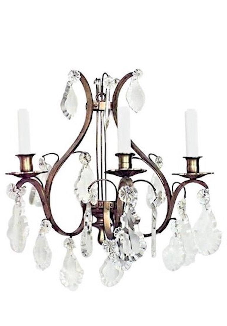 8 French Louis XV-style (20th Century) bronze and crystal wall sconces with three arms and lyre design. (PRICED EACH)
