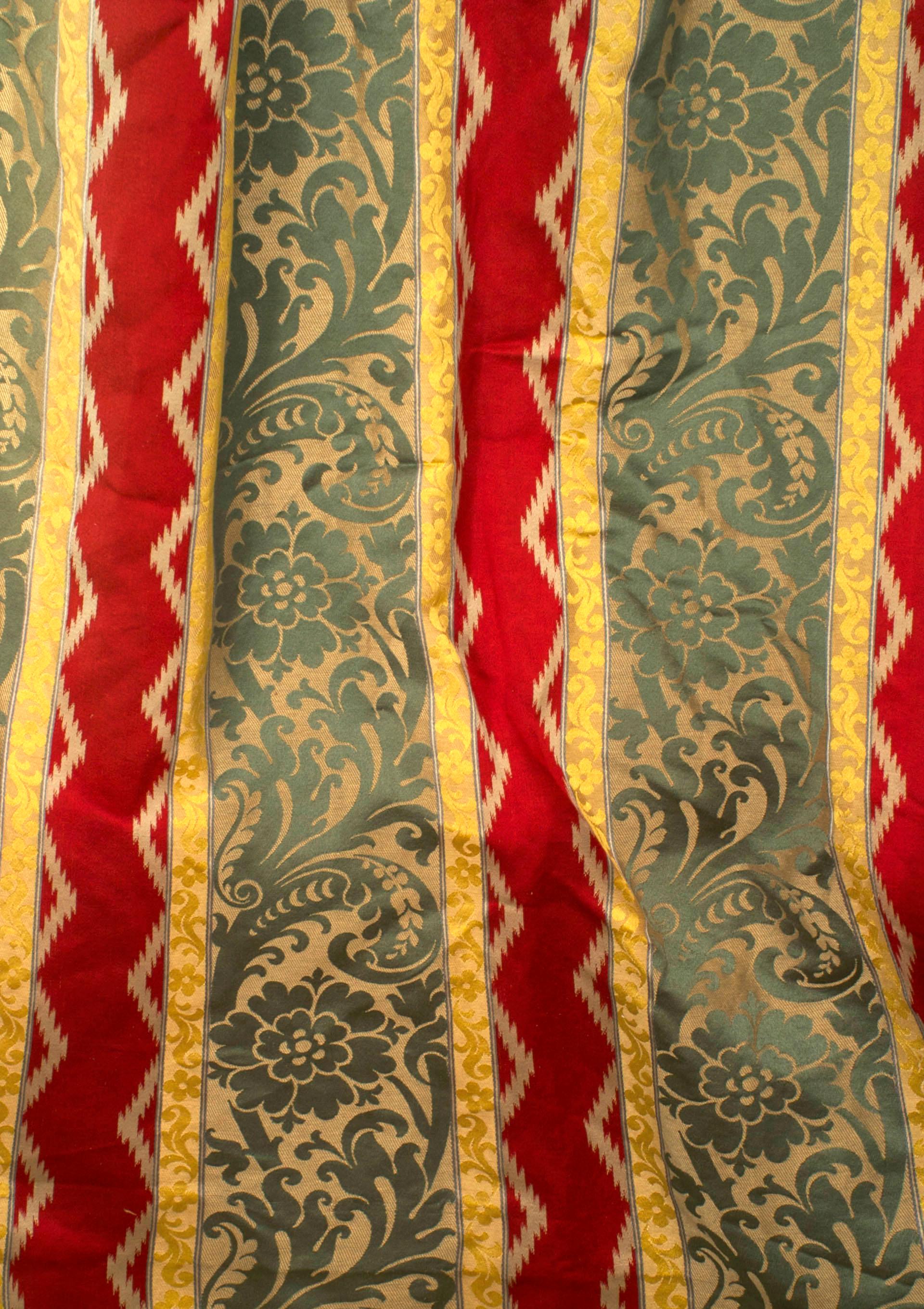 3 Pairs of French Victorian style damask drapes with green, red and gold striped floral and scroll design panels with brass gold ring for hanging (priced per pair).
 