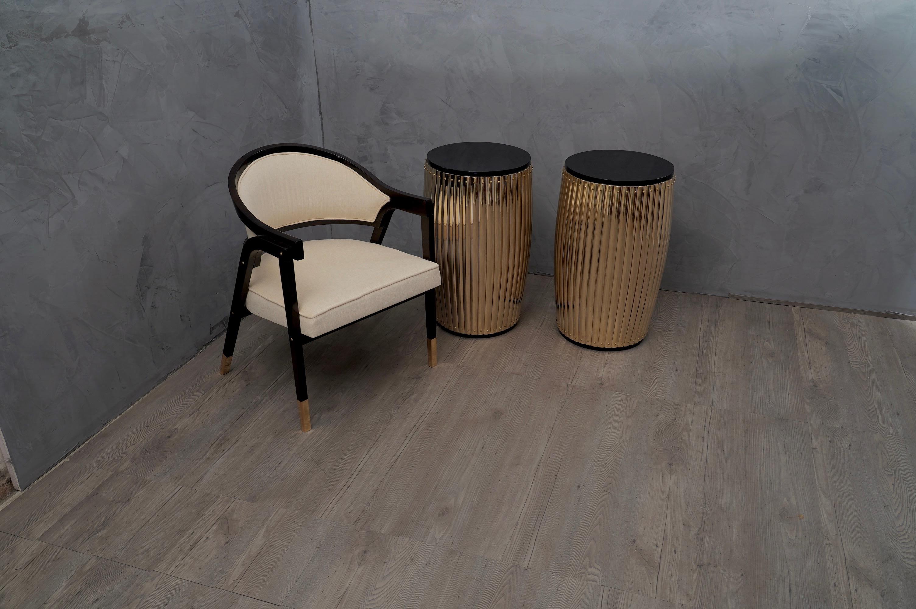 Couple of stylish side tables, is very clean and architectural in its shape, but precisely this combination brings out a very elegant and unmistakable design. This slick material turns this table into a modernist sculpture with round shape. 

The