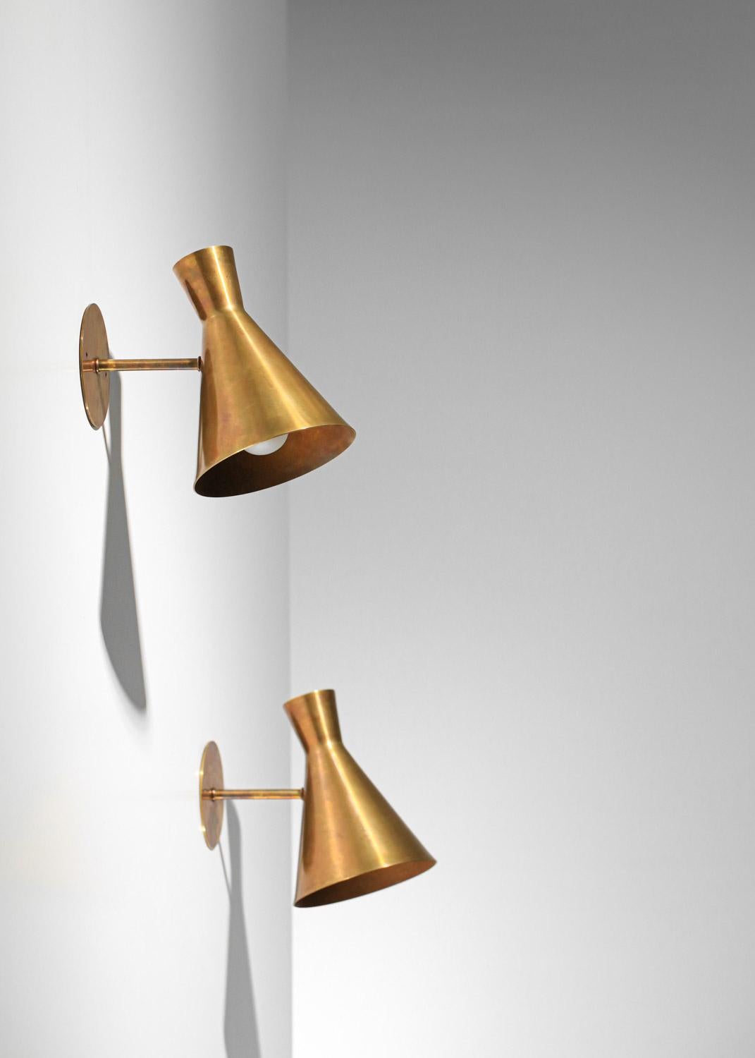 Pair of modern diabolo sconces in solid brass. 
Modern craftsmanship. 
Structure and shade in patinated solid brass. 
(inspired by Paavo Tynell)