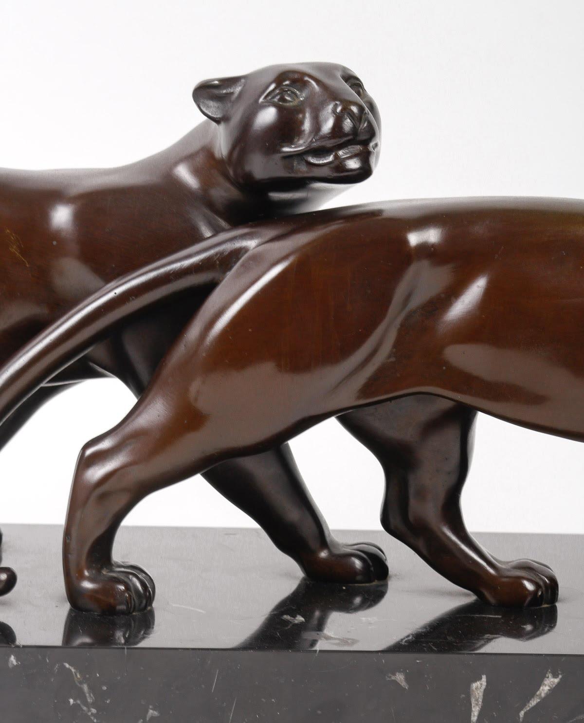 Pairs of Panthers in Patinated Bronze by Lucien Alliot.

Sculpture of a pair of Panthers in patinated bronze and black marble base by Lucien Alliot ( 1877-1967), early 20th century.

H: 26cm, W: 80cm, D: 18cm