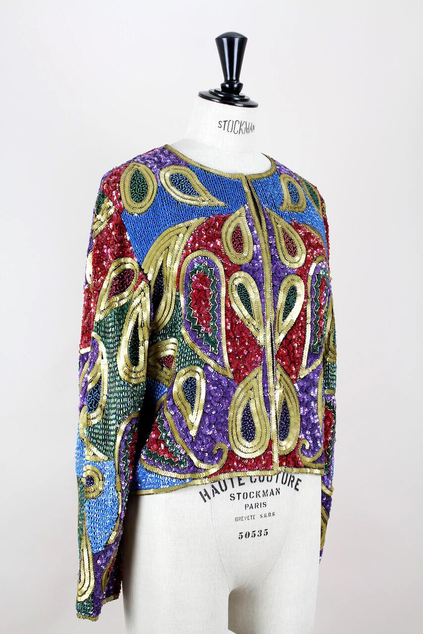 Stunning heavily beaded and sequined multi color paisley design silk evening jacket from the 1990s. 