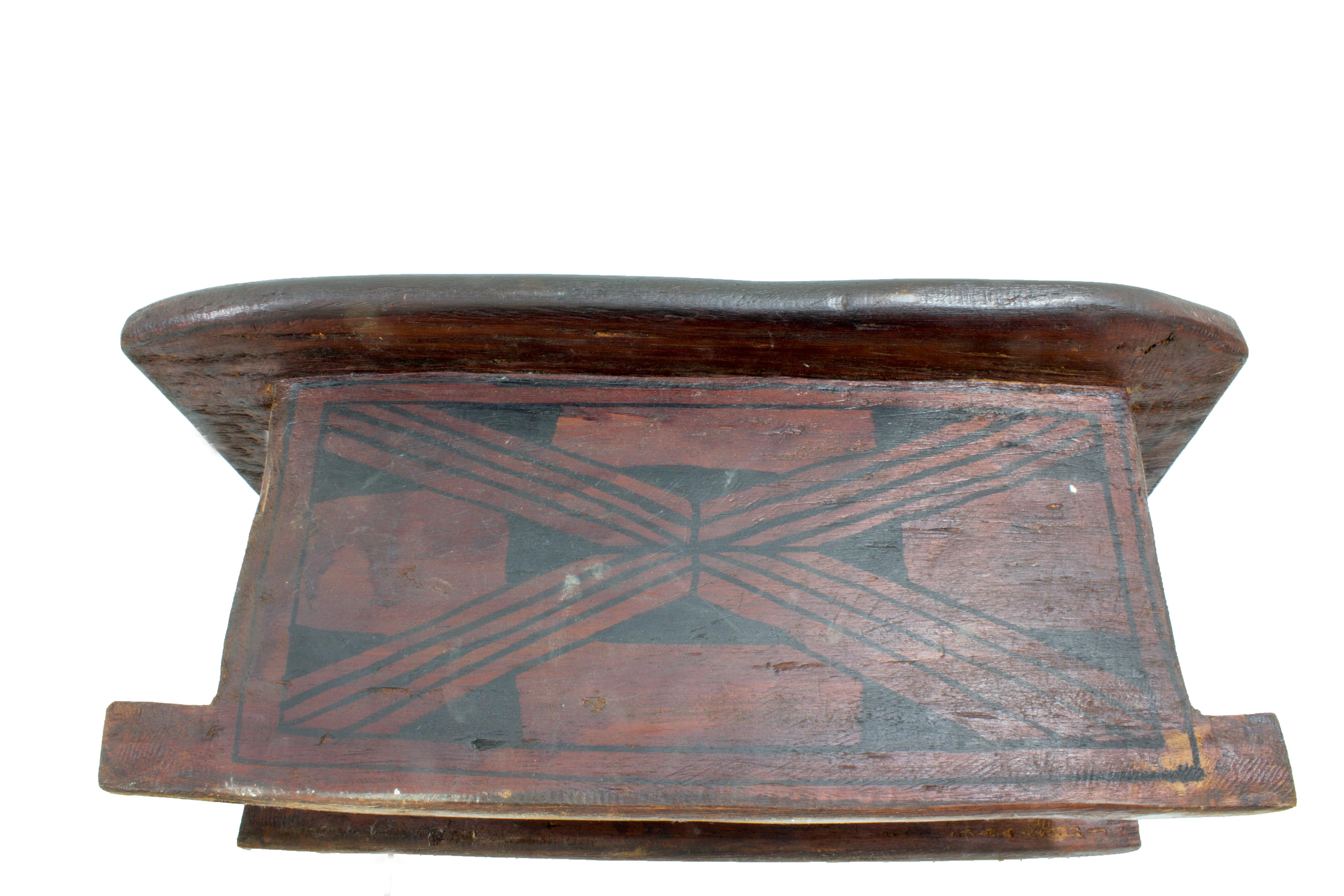 This Brazilian Pajé stool was made by the Xingu Waujá tribe. Stools combine functionality and beauty; they are wood-carved after animals found in Brazilian forests, or geometric-shaped and decorated with notches or natural pigment designs. More than
